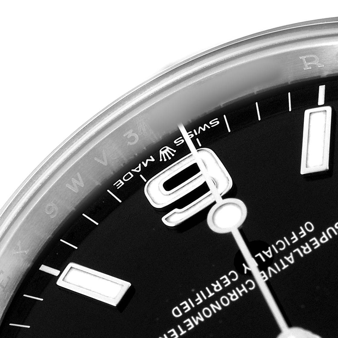 The image shows a close-up of the Rolex Explorer 224270 Men's Stainless Steel Black Dial's dial featuring the number 9, markers, and a portion of the hour hand.