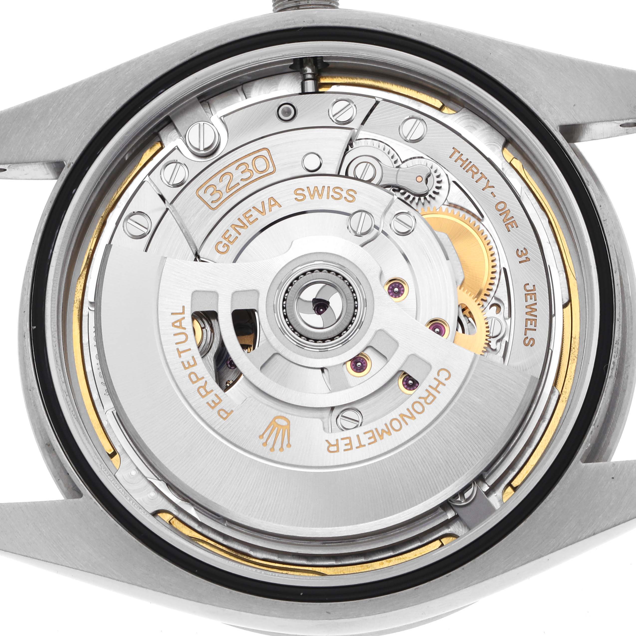 The image shows a close-up view of the Rolex Explorer 224270 Men's Stainless Steel Black Dial watch's movement, highlighting the rotor and internal mechanisms.