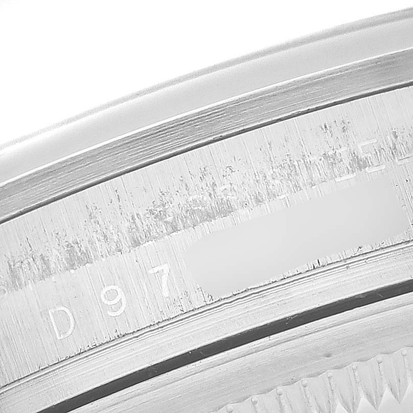 This image shows a close-up of the serial number engraving on the bezel of a Rolex Explorer 114270 Men
s Stainless Steel Black Dial 114270 Men
s Stainless Steel Black Dial watch.