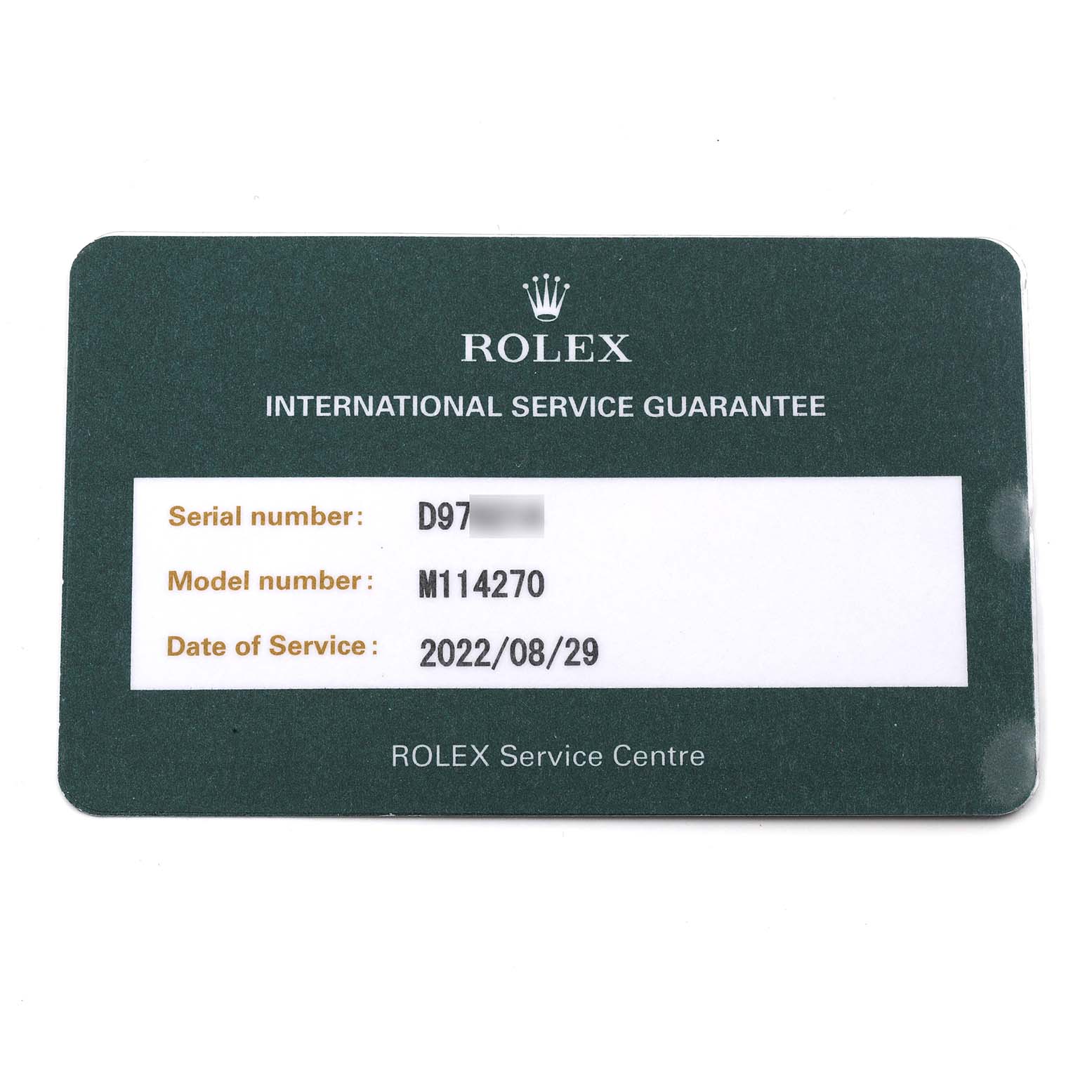 The image shows an International Service Guarantee card for a Rolex Explorer 114270 Men
s Stainless Steel Black Dial 114270 Men
s Stainless Steel Black Dial model with serial and model numbers and a service date.