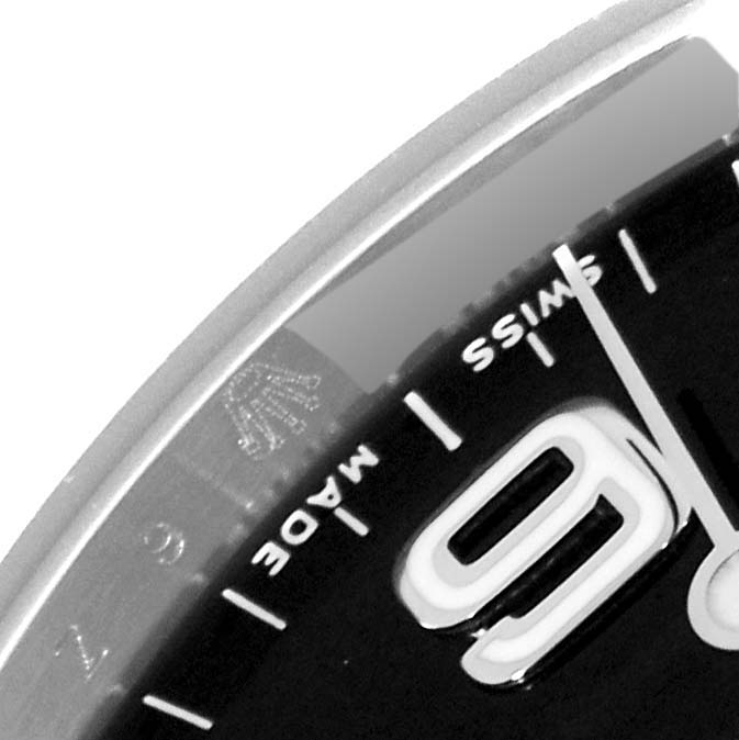 The image shows a close-up of the dial and bezel of a Rolex Explorer 114270 Men
s Stainless Steel Black Dial 114270 Men
s Stainless Steel Black Dial watch, focusing on the "9," "SWISS MADE," and the crown logo.