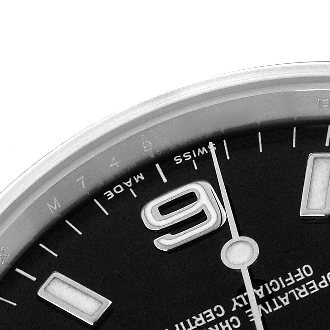 The image shows a close-up of the Rolex Explorer 114270 Men's Stainless Steel Black Dial 114270 Men's Stainless Steel Black Dial watch face, focusing on the numeral "9" and part of the minute markers.
