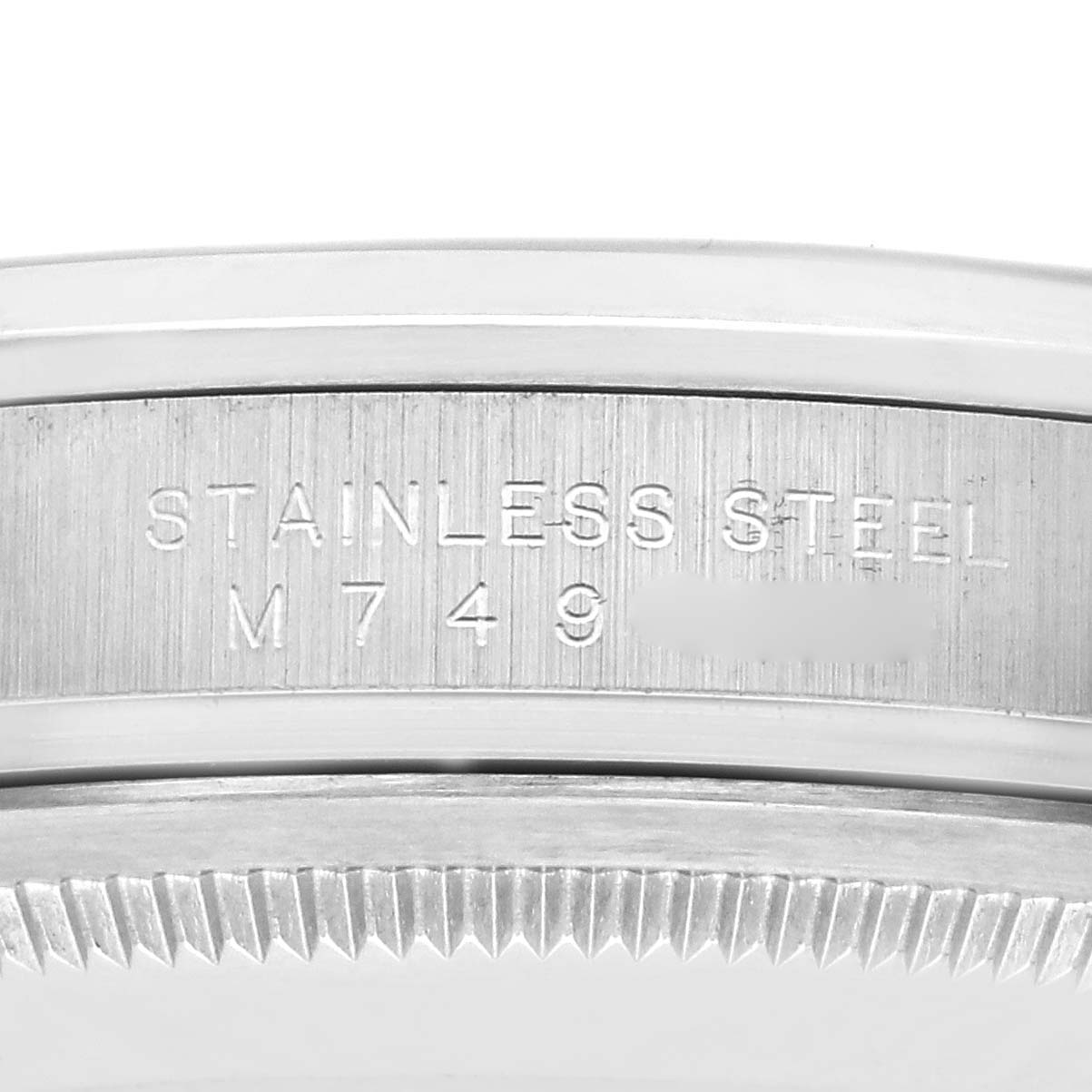 The image shows a close-up of the stainless steel case edge with engravings on the Rolex Explorer 114270 Men's Stainless Steel Black Dial 114270 Men's Stainless Steel Black Dial model.