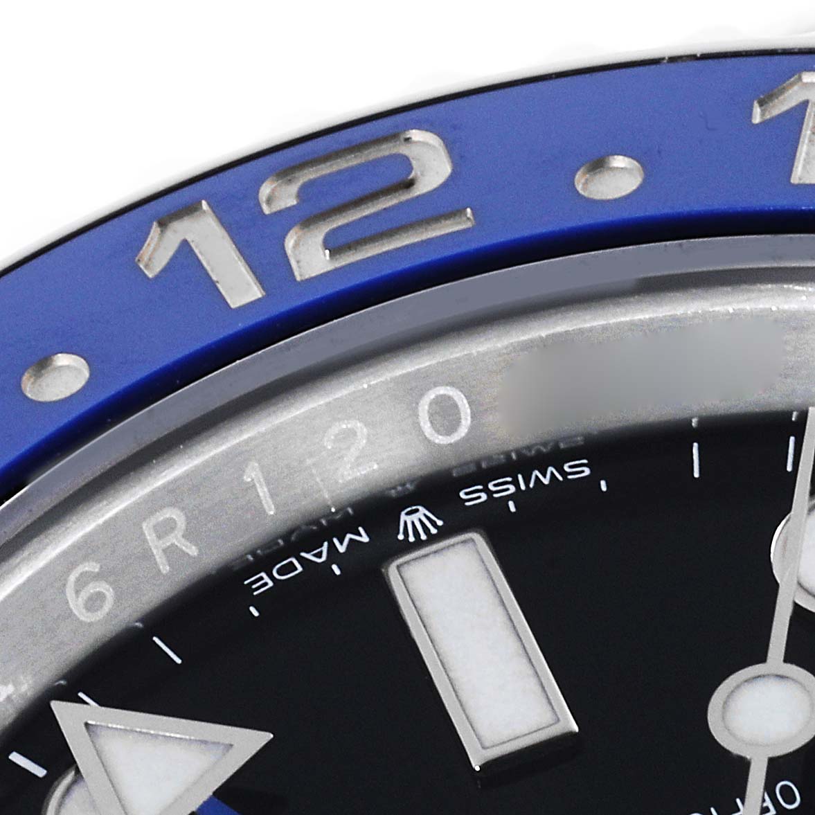 This close-up image of the Rolex GMT-Master 126710 Men's Stainless Steel Black Dial 126710 Men's Stainless Steel Black Dial watch focuses on the bezel and part of the dial.