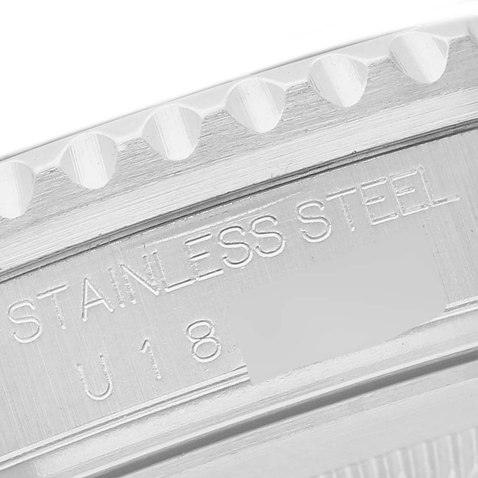 This image shows a close-up of the serial number and bezel of a Rolex GMT-Master 16710 Men's Stainless Steel Black Dial 16710 Men's Stainless Steel Black Dial watch.