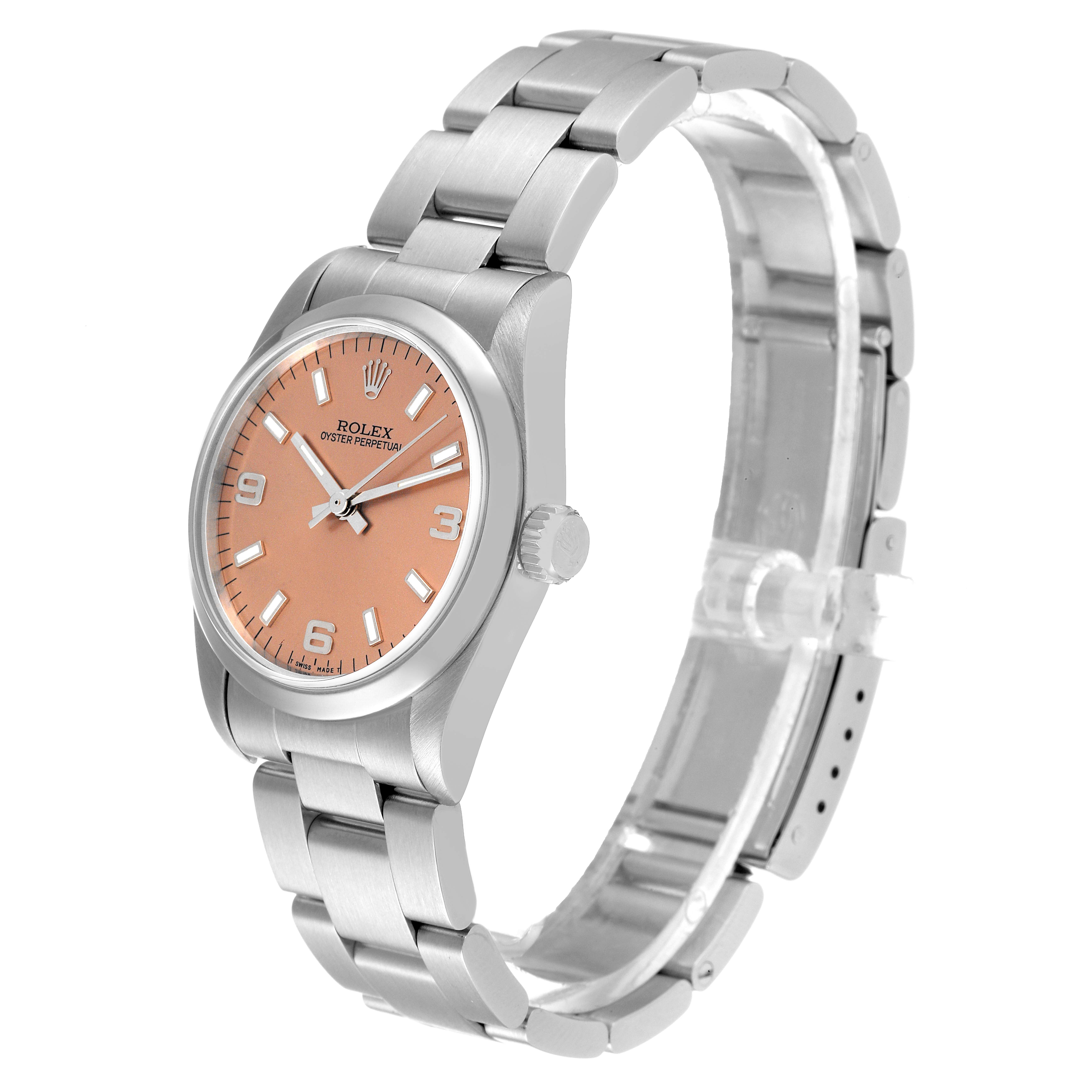 The image shows a Rolex Mid-Size 67480 Women
s Stainless Steel Pink Dial 67480 Women
s Stainless Steel Pink Dial model watch from a top angled view, featuring its pink dial, stainless steel case, and bracelet.