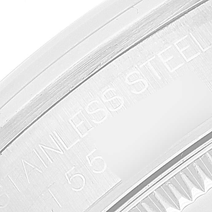 This image shows a close-up of the stainless steel casing of a Rolex Mid-Size 67480 Women
s Stainless Steel Pink Dial 67480 Women
s Stainless Steel Pink Dial model watch, highlighting the engraving.