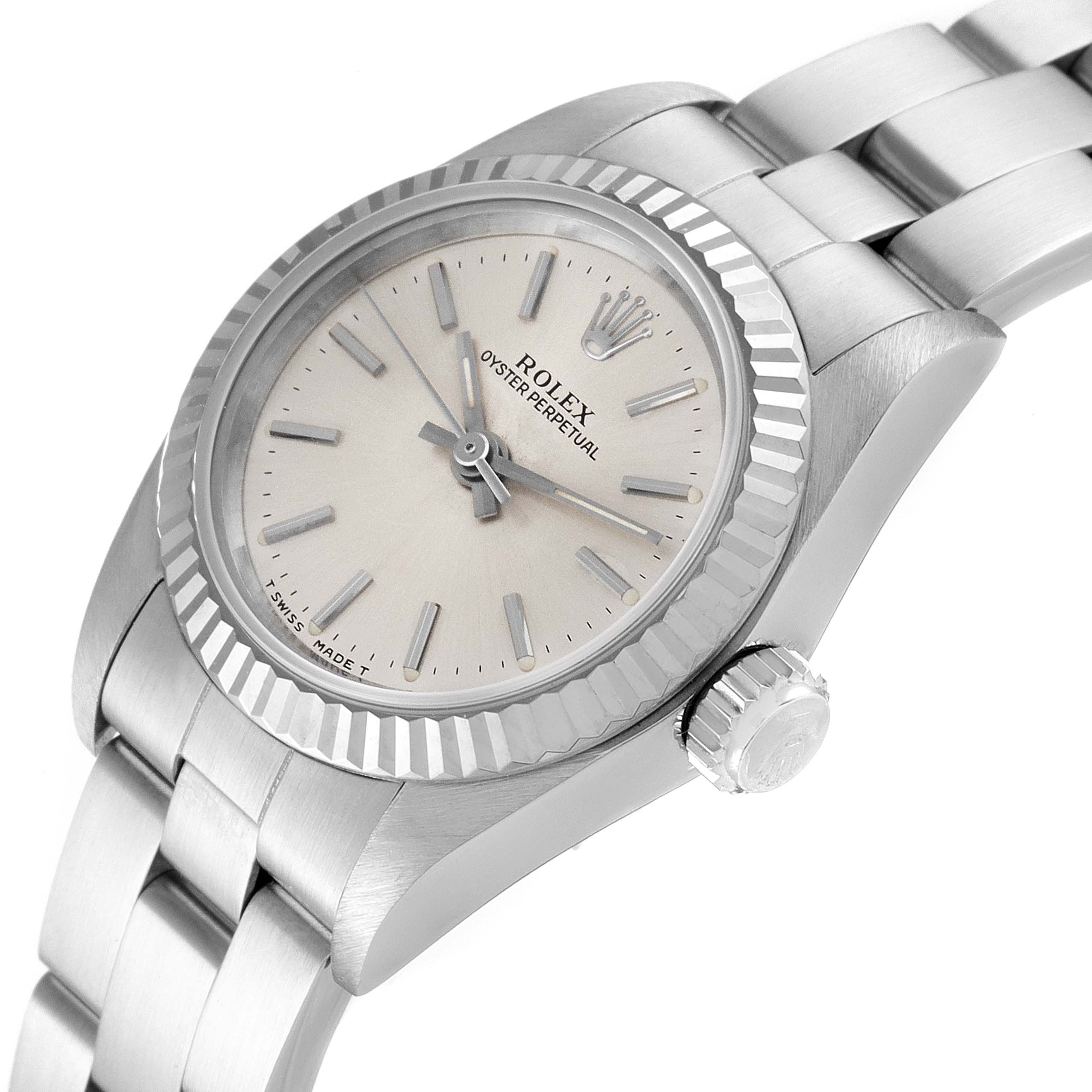 This Rolex Oyster Perpetual 67194 Women's Stainless Steel Silver Dial 67194 Women's Stainless Steel Silver Dial watch is shown from an angled close-up, highlighting its crown, bezel, face, and bracelet.