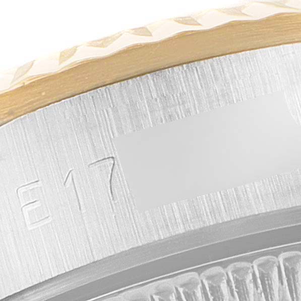 The image shows a close-up of the side of the bezel and case of a Rolex Oyster Perpetual 67193 Women
s Steel and Gold (two tone) Champagne Dial 67193 Women
s Steel and Gold (two tone) Champagne Dial watch.