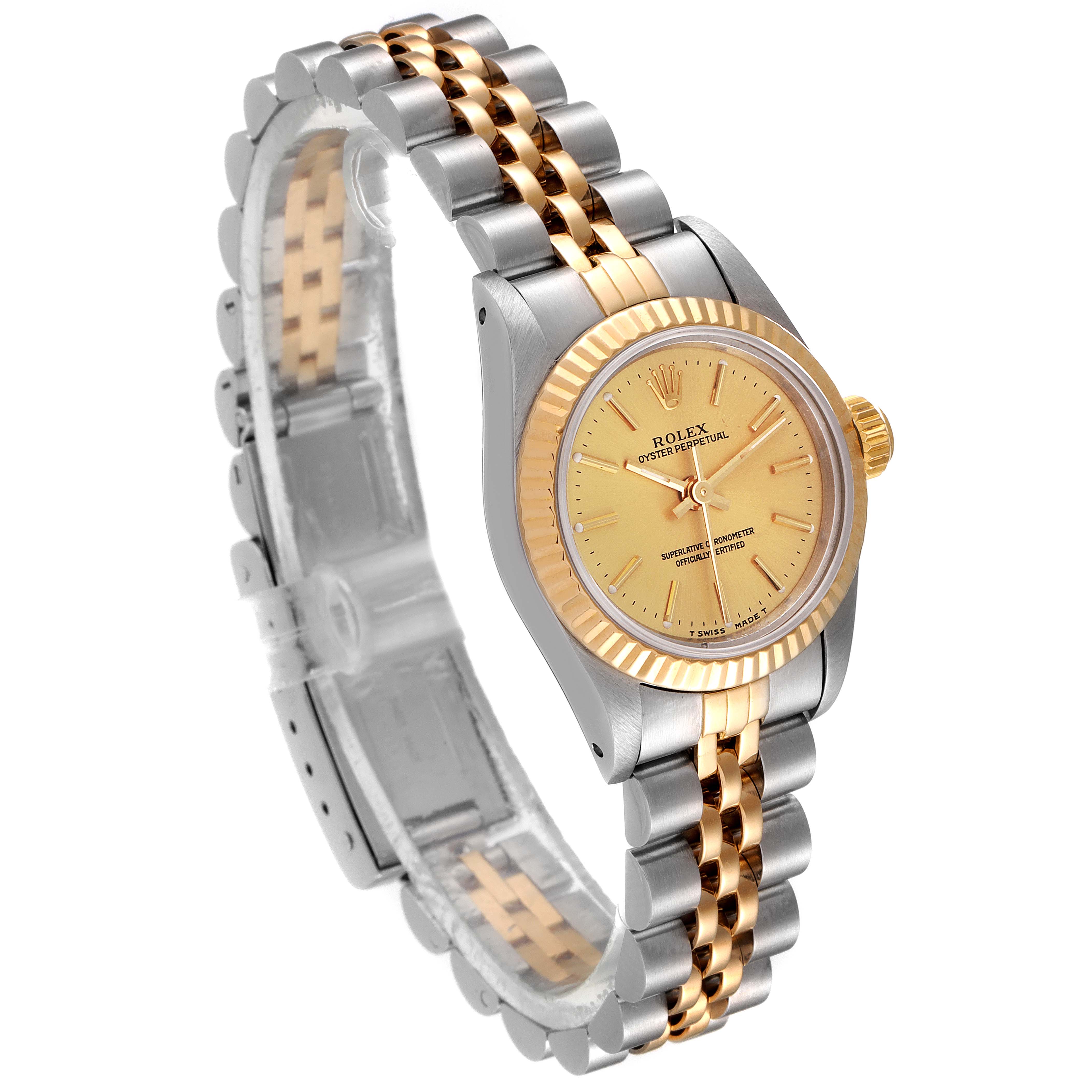 The image shows a Rolex Oyster Perpetual 67193 Women
s Steel and Gold (two tone) Champagne Dial 67193 Women
s Steel and Gold (two tone) Champagne Dial watch at an angle highlighting the face, bezel, case, and bracelet.