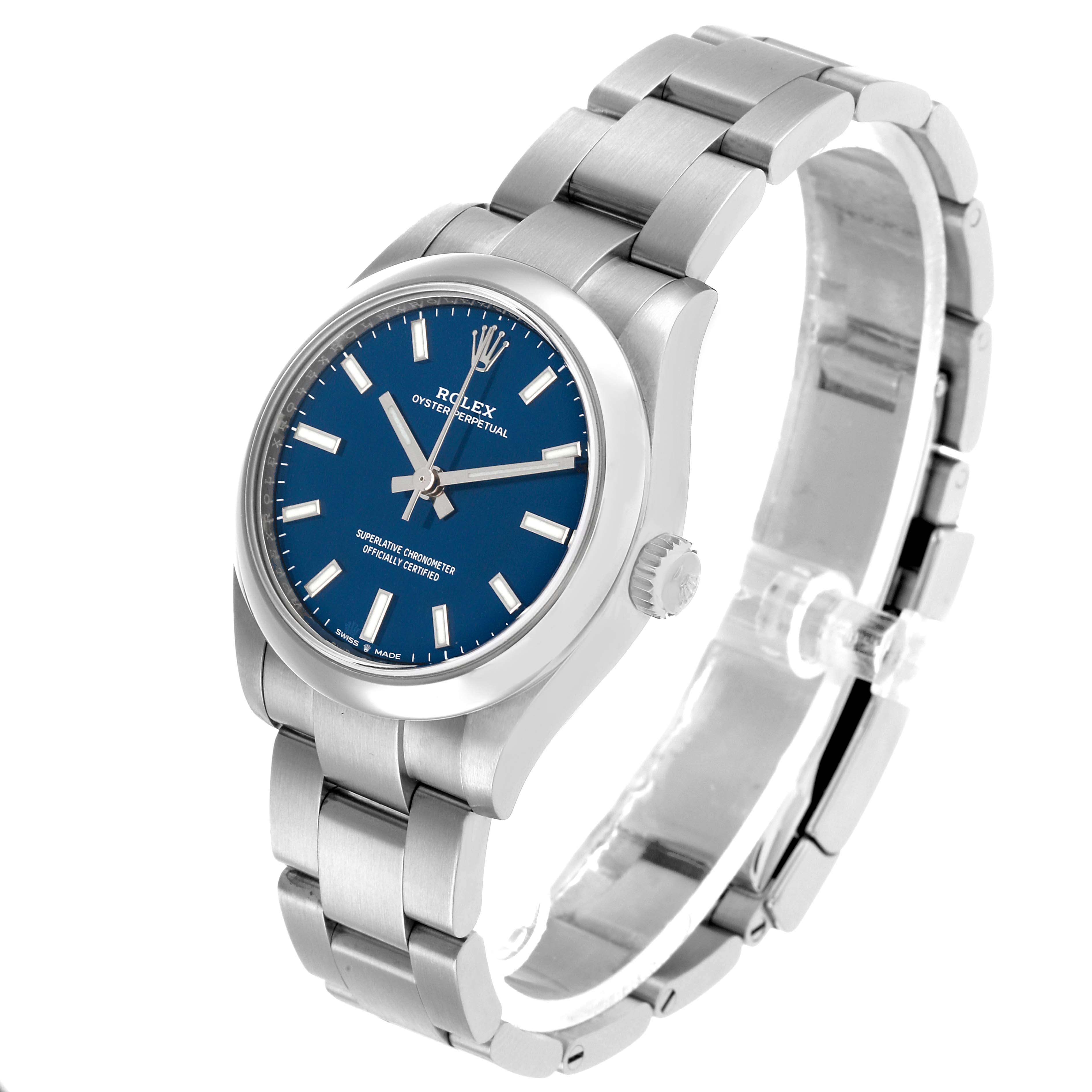 The Rolex Oyster Perpetual 277200 Women's Stainless Steel Blue Dial watch is shown at a three-quarter angle, displaying the face, bezel, case, crown, and part of the bracelet.