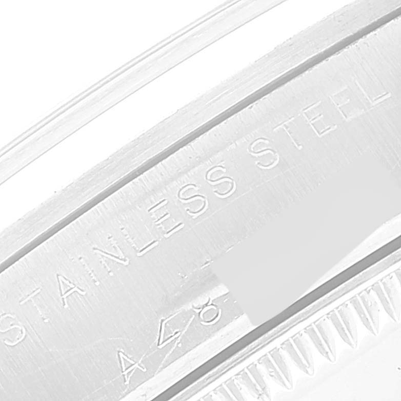 This close-up image shows the engraved markings on the stainless steel back of a Rolex Mid-Size 77080 Women
s Stainless Steel Blue Dial 77080 Women
s Stainless Steel Blue Dial model watch.