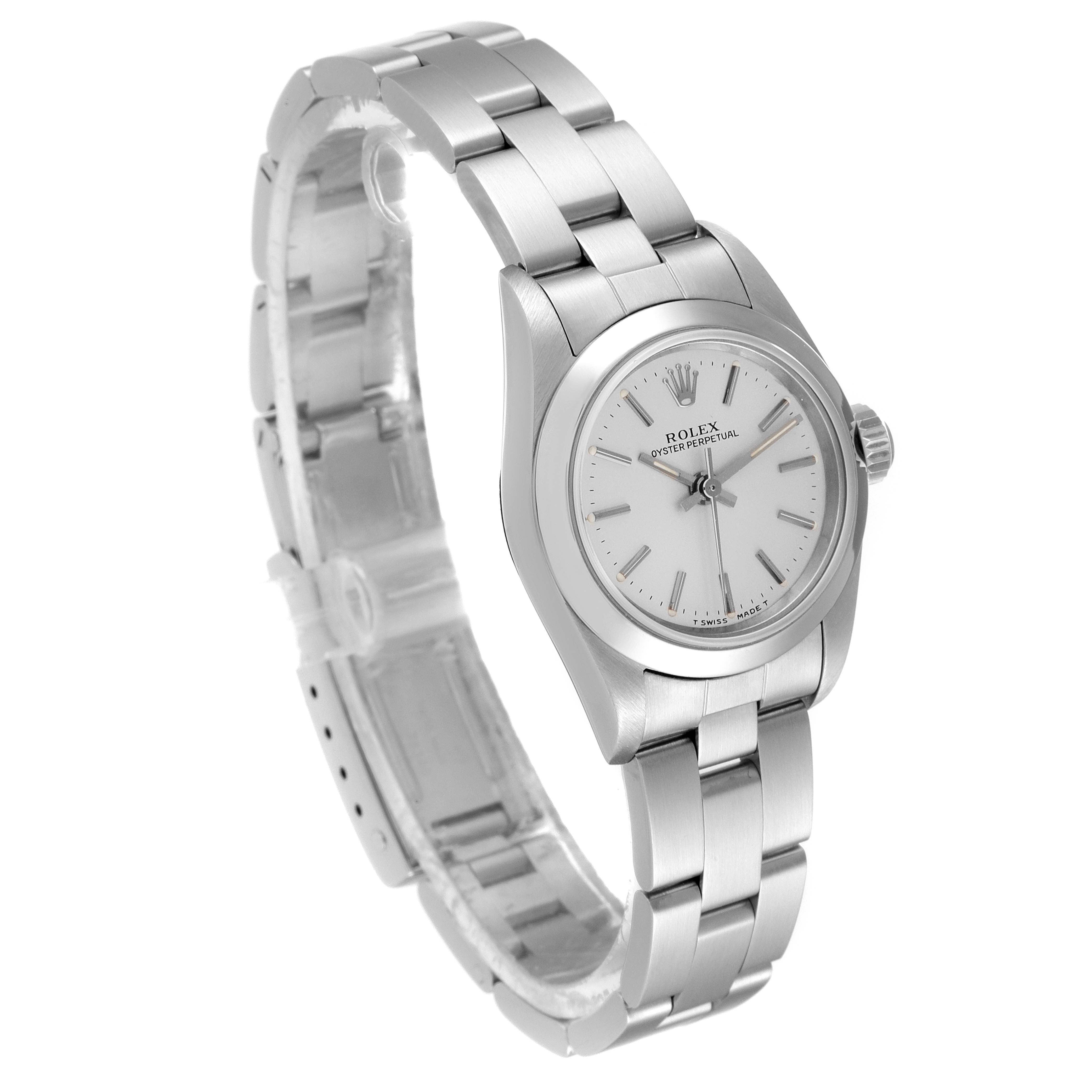 This image shows a Rolex Oyster Perpetual 67180 Women's Stainless Steel Silver Dial 67180 Women's Stainless Steel Silver Dial watch at a slight diagonal angle, highlighting the face and part of the bracelet.
