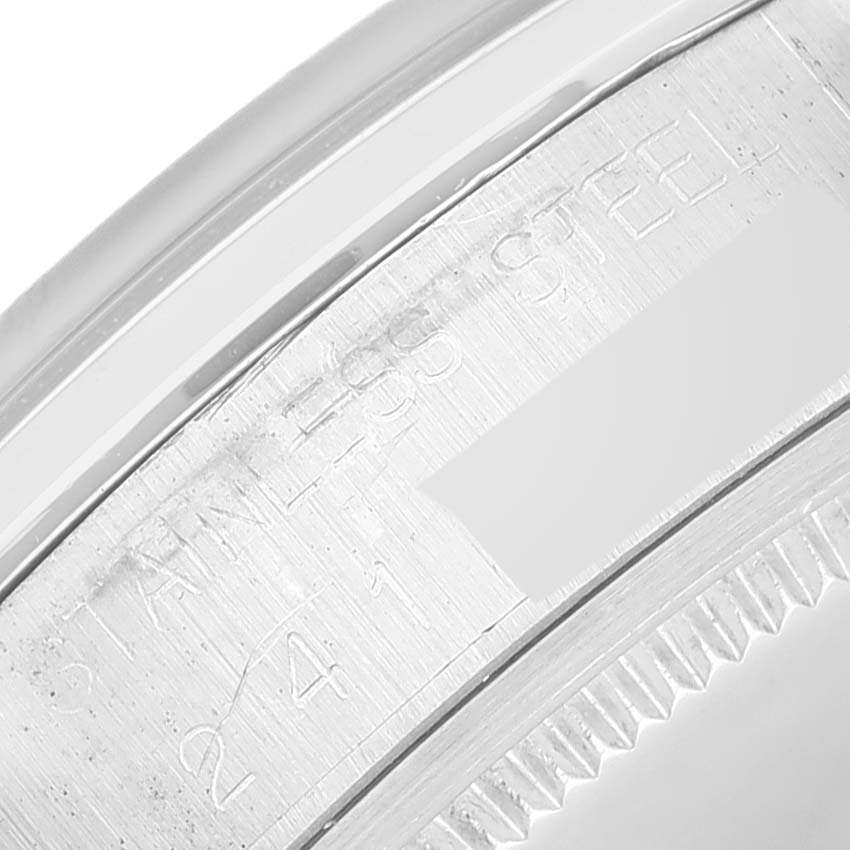 The image shows the engraved side of the bezel for the Rolex Vintage Collection 6694 Men's Stainless Steel Silver Dial 6694 Men's Stainless Steel Silver Dial model, highlighting the "STAINLESS STEEL" text.