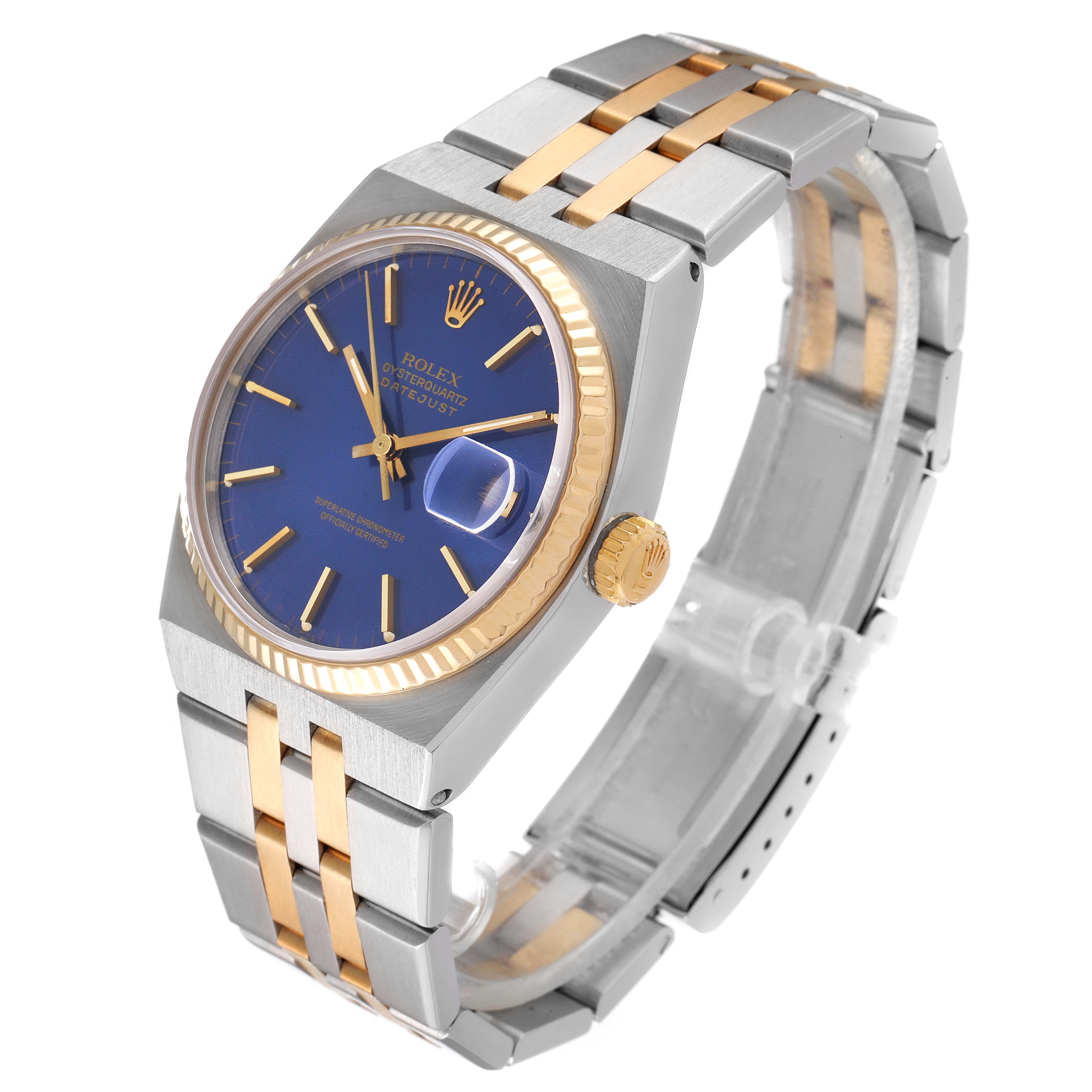 The Rolex Oysterquartz 17013 Men's Steel and Gold (two tone) Blue Dial 17013 Men's Steel and Gold (two tone) Blue Dial watch is shown at an angle highlighting the face, crown, bezel, and bracelet.