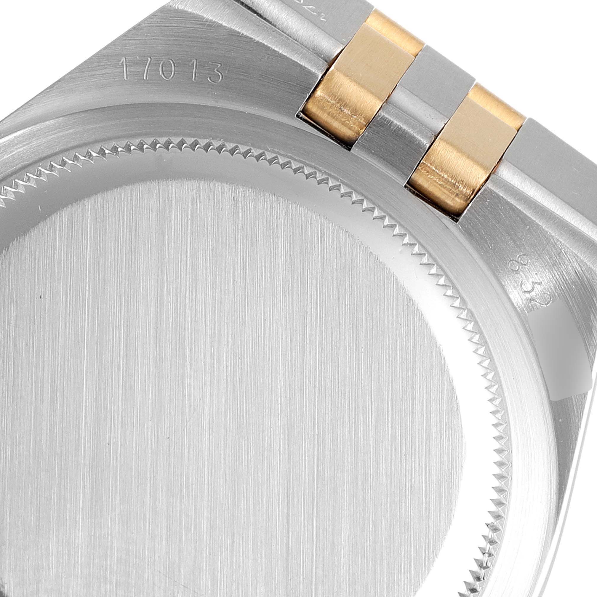 The image shows the back case and part of the bracelet of the Rolex Oysterquartz 17013 Men's Steel and Gold (two tone) Blue Dial 17013 Men's Steel and Gold (two tone) Blue Dial model, viewed from the rear angle.