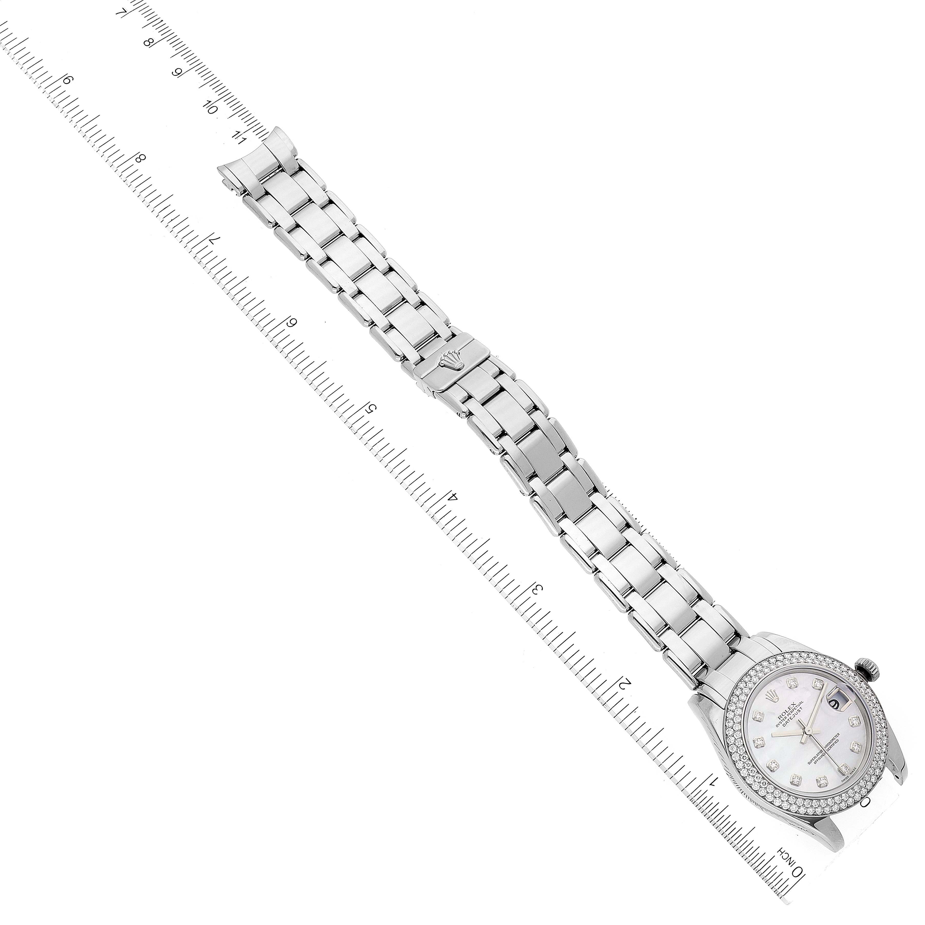 The image shows a top-down view of a Rolex Pearlmaster 81339 Women's White Gold Mother of Pearl Dial 81339 Women's White Gold Mother of Pearl Dial watch and its metal bracelet, with a ruler for scale.