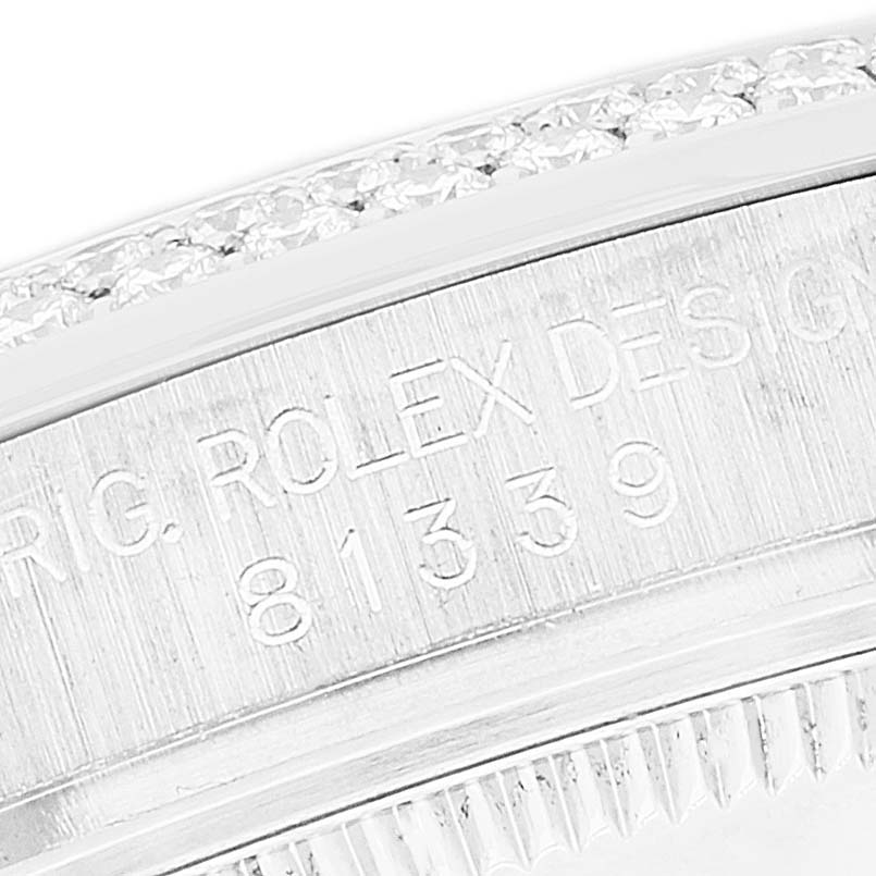 The image shows a close-up angle of the engraved side of a Rolex Pearlmaster 81339 Women's White Gold Mother of Pearl Dial 81339 Women's White Gold Mother of Pearl Dial watch case, highlighting the model number 81339 and part of the bezel with diamonds.