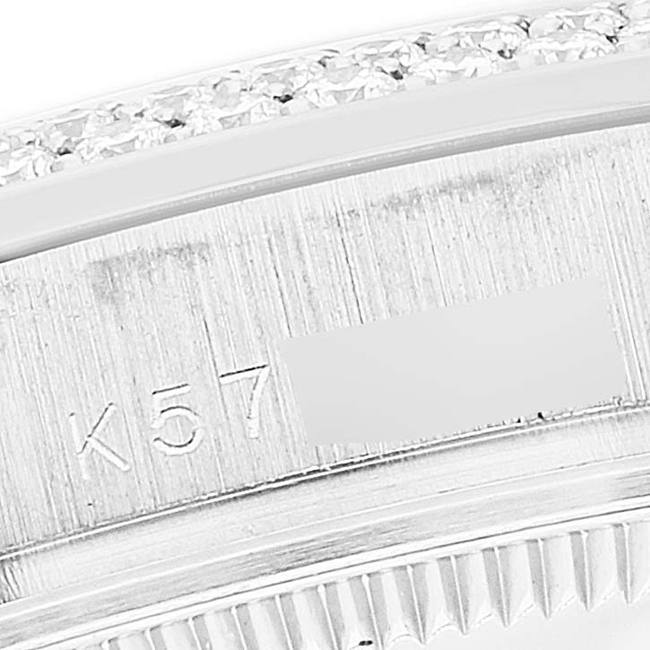 This close-up angle shows part of the bezel and engraved inner ring of the Rolex Pearlmaster 81339 Women's White Gold Mother of Pearl Dial 81339 Women's White Gold Mother of Pearl Dial watch.