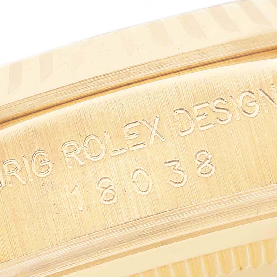 Close-up of the side bezel and engraved serial number on a Rolex President 18038 Men
s Yellow Gold Champagne Dial 18038 Men
s Yellow Gold Champagne Dial model watch.