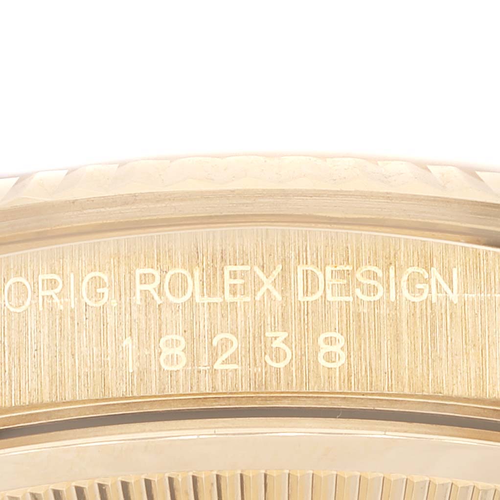 This image shows a close-up of the edge and engraving of the Rolex President 18238 Men's Yellow Gold Champagne Dial 18238 Men's Yellow Gold Champagne Dial watch case.