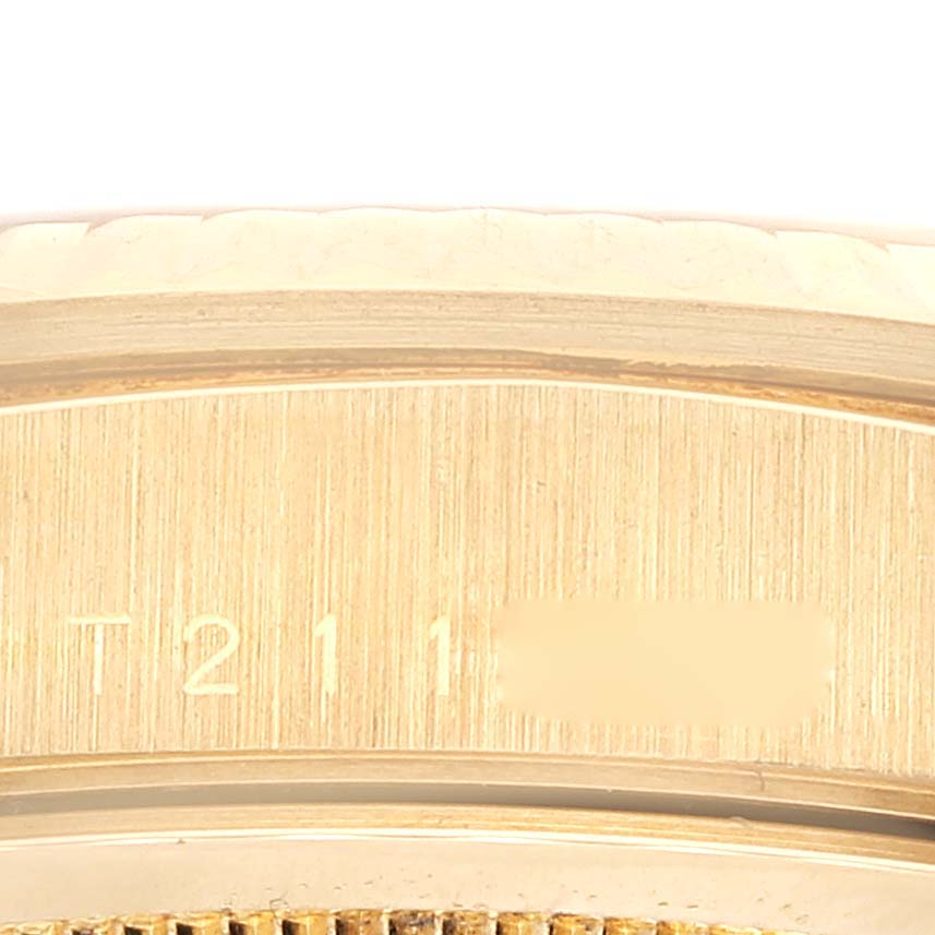 The image shows a close-up of the side of a Rolex President 18238 Men's Yellow Gold Champagne Dial 18238 Men's Yellow Gold Champagne Dial watch, highlighting the serial number.