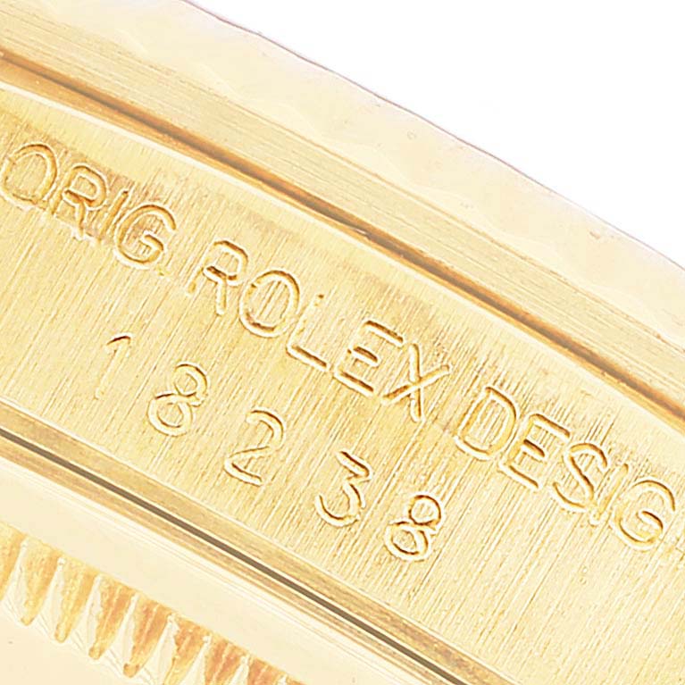 This image shows a close-up of the inner case and serial number of a Rolex President 18238 Men's Yellow Gold Champagne Dial 18238 Men's Yellow Gold Champagne Dial model.