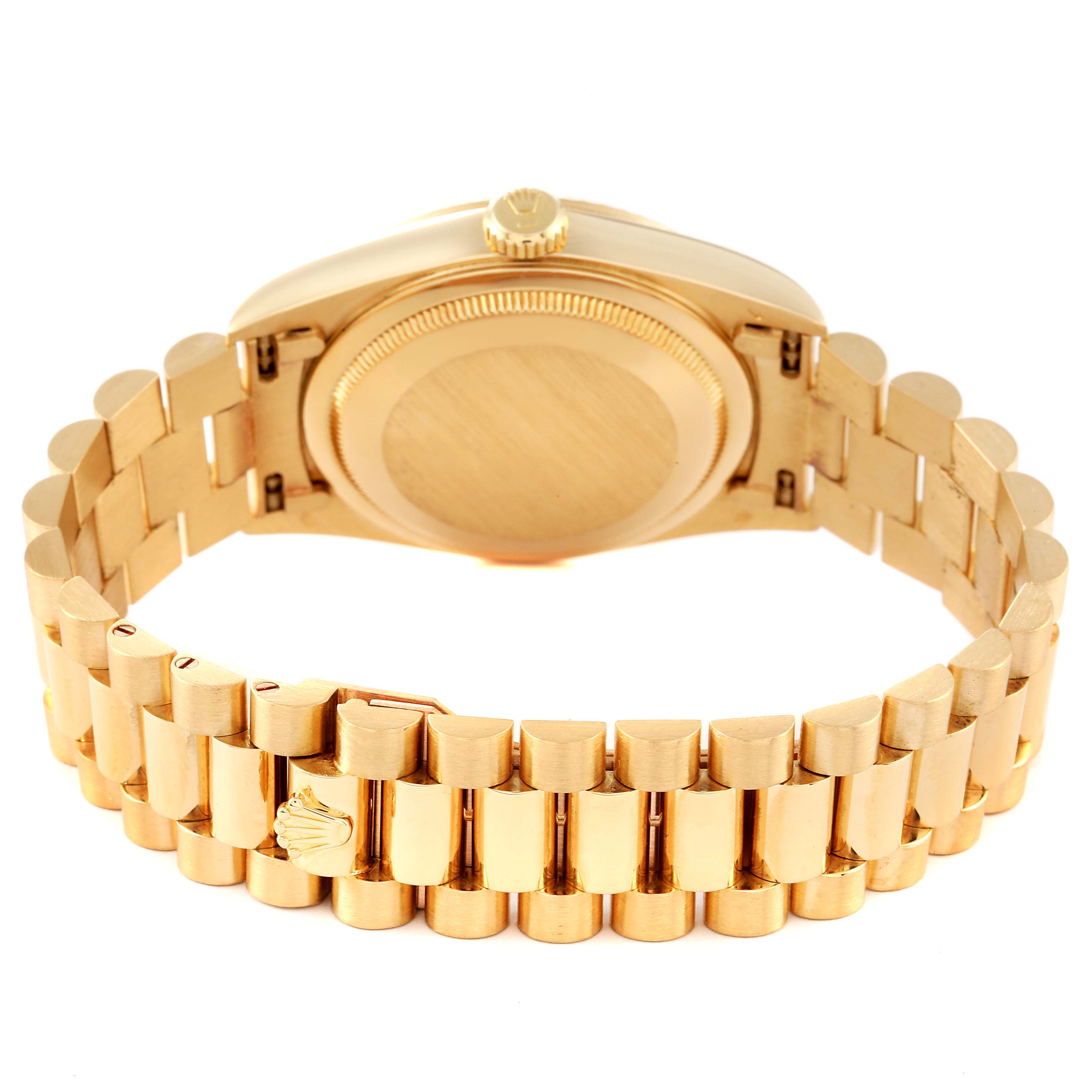 This image shows the backside of a Rolex President 18238 Men's Yellow Gold Champagne Dial 18238 Men's Yellow Gold Champagne Dial model watch, highlighting the case back and bracelet.