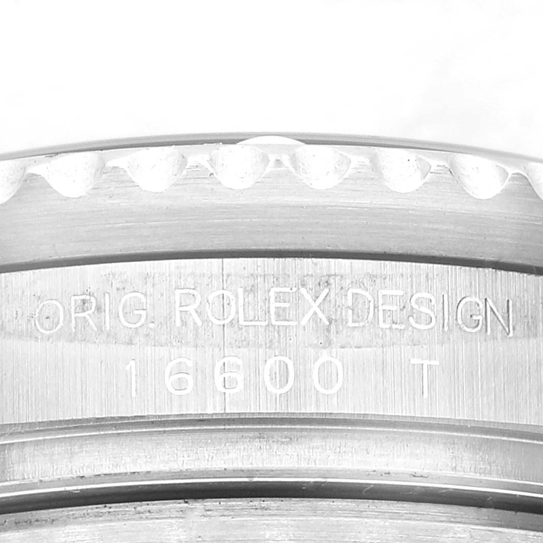 This image shows a close-up of the case back edge of a Rolex Sea-Dweller 16600T Men
s Stainless Steel Black Dial 16600T Men
s Stainless Steel Black Dial model 16600, featuring the model number engraving.