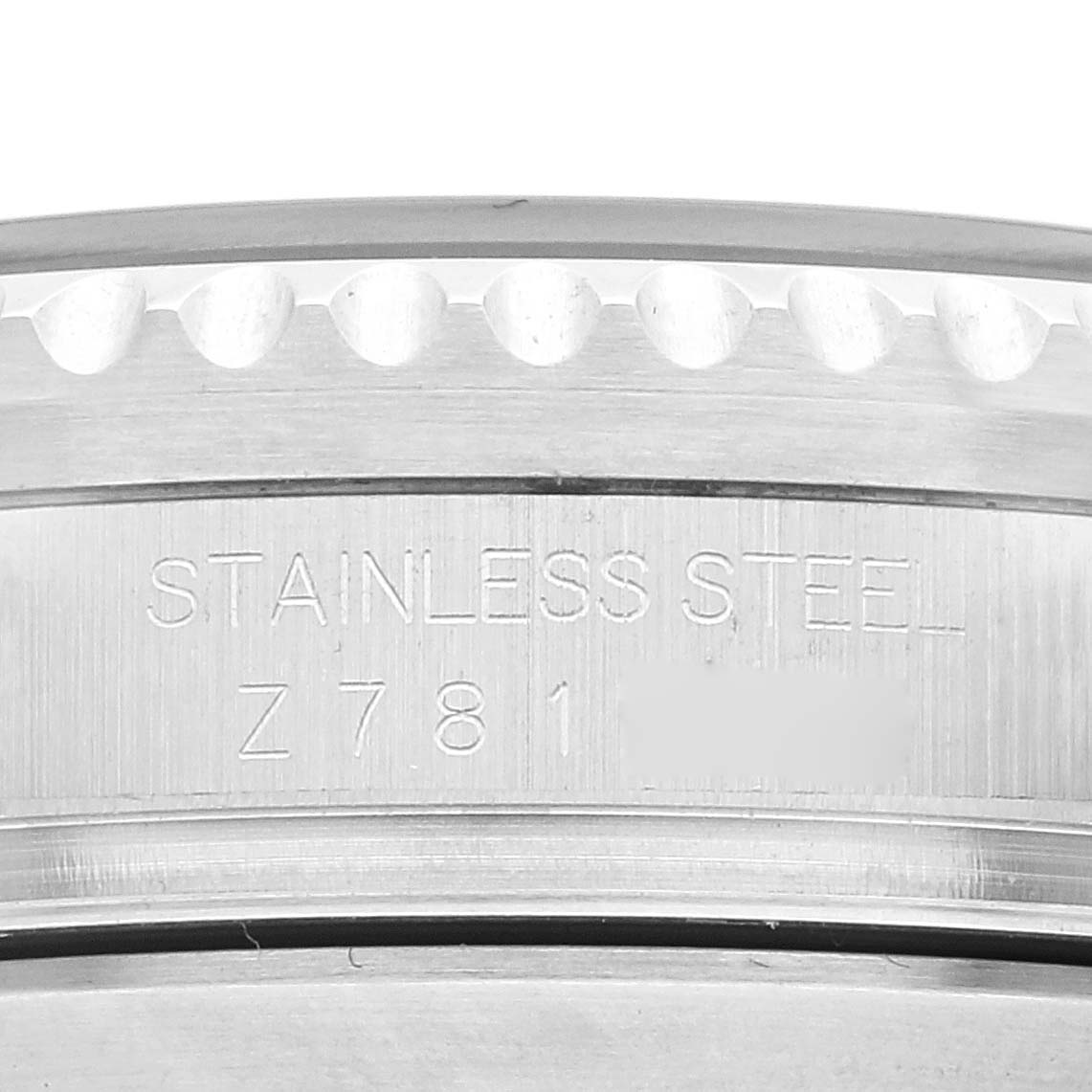 The image shows a close-up of the case back's edge featuring the "STAINLESS STEEL" engraving on a Rolex Sea-Dweller 16600T Men's Stainless Steel Black Dial 16600T Men's Stainless Steel Black Dial watch.