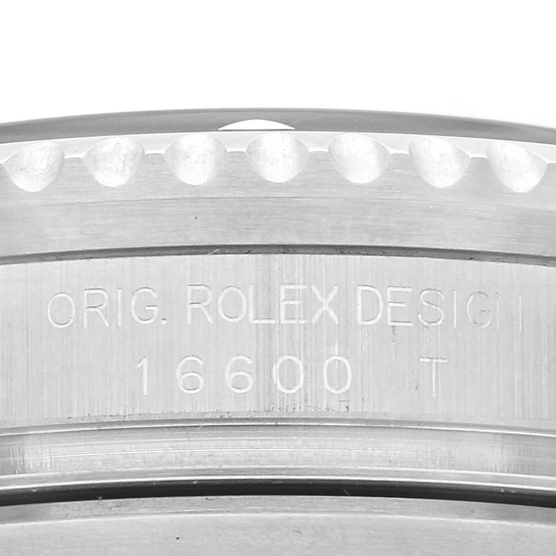 The image shows a close-up view of the engraved side of a Rolex Sea-Dweller 16600T Men's Stainless Steel Black Dial 16600T Men's Stainless Steel Black Dial watch, model 16600 T.