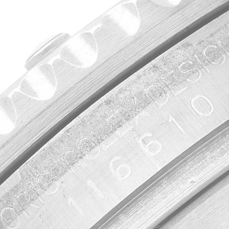 This close-up image shows the engraved model number and the outer edge of the bezel of a Rolex Submariner 116610LV Men
s Stainless Steel Green Dial 116610LV Men
s Stainless Steel Green Dial watch.