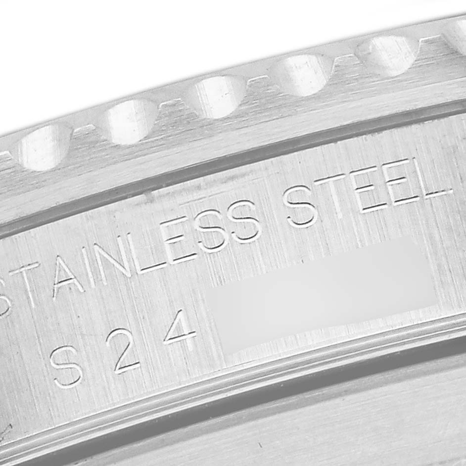 The image shows a close-up of the engraved back part of a Rolex Submariner 14060 Men
s Stainless Steel Black Dial 14060 Men
s Stainless Steel Black Dial, highlighting the stainless steel text.