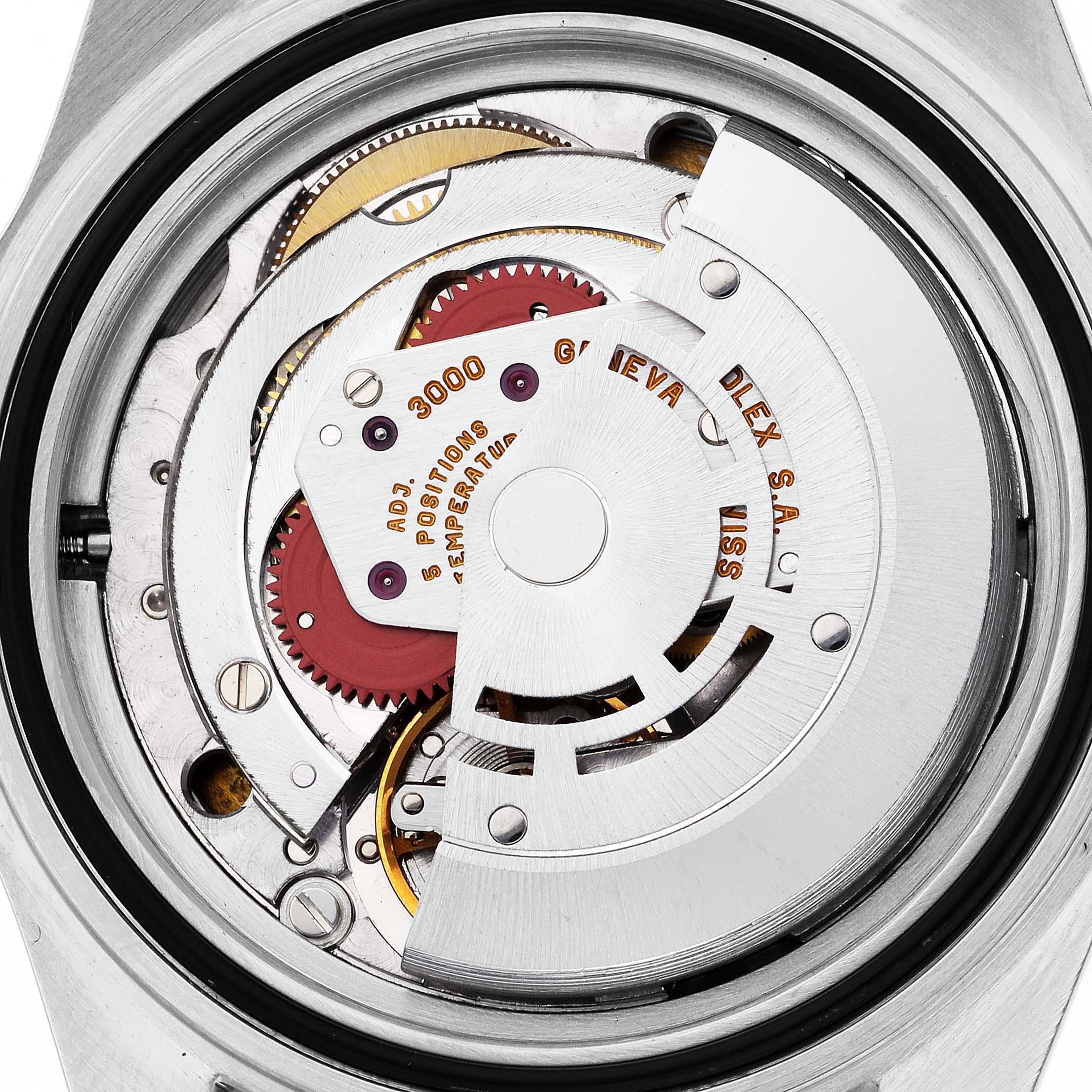 The image shows the movement of the Rolex Submariner 14060 Men
s Stainless Steel Black Dial 14060 Men
s Stainless Steel Black Dial, focusing on the intricate internal components.