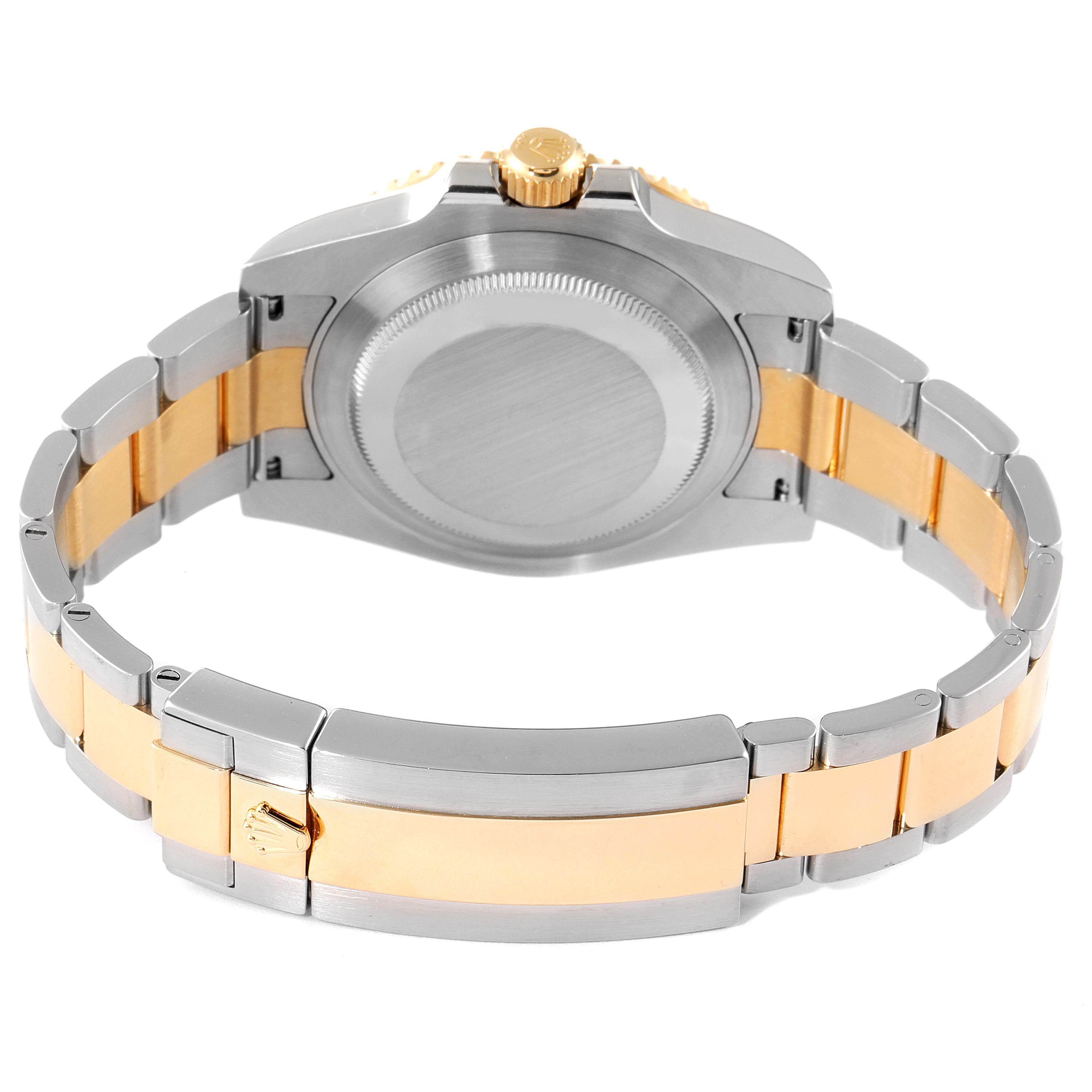 The image shows the back and bracelet of a Rolex Submariner 116613 Men's Steel and Gold (two tone) Blue Dial 116613 Men's Steel and Gold (two tone) Blue Dial watch with a two-tone metal design.