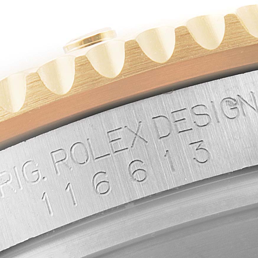 The image shows an angled close-up of the bezel and case side of a Rolex Submariner 116613 Men's Steel and Gold (two tone) Blue Dial 116613 Men's Steel and Gold (two tone) Blue Dial watch, displaying its model and brand engraving.