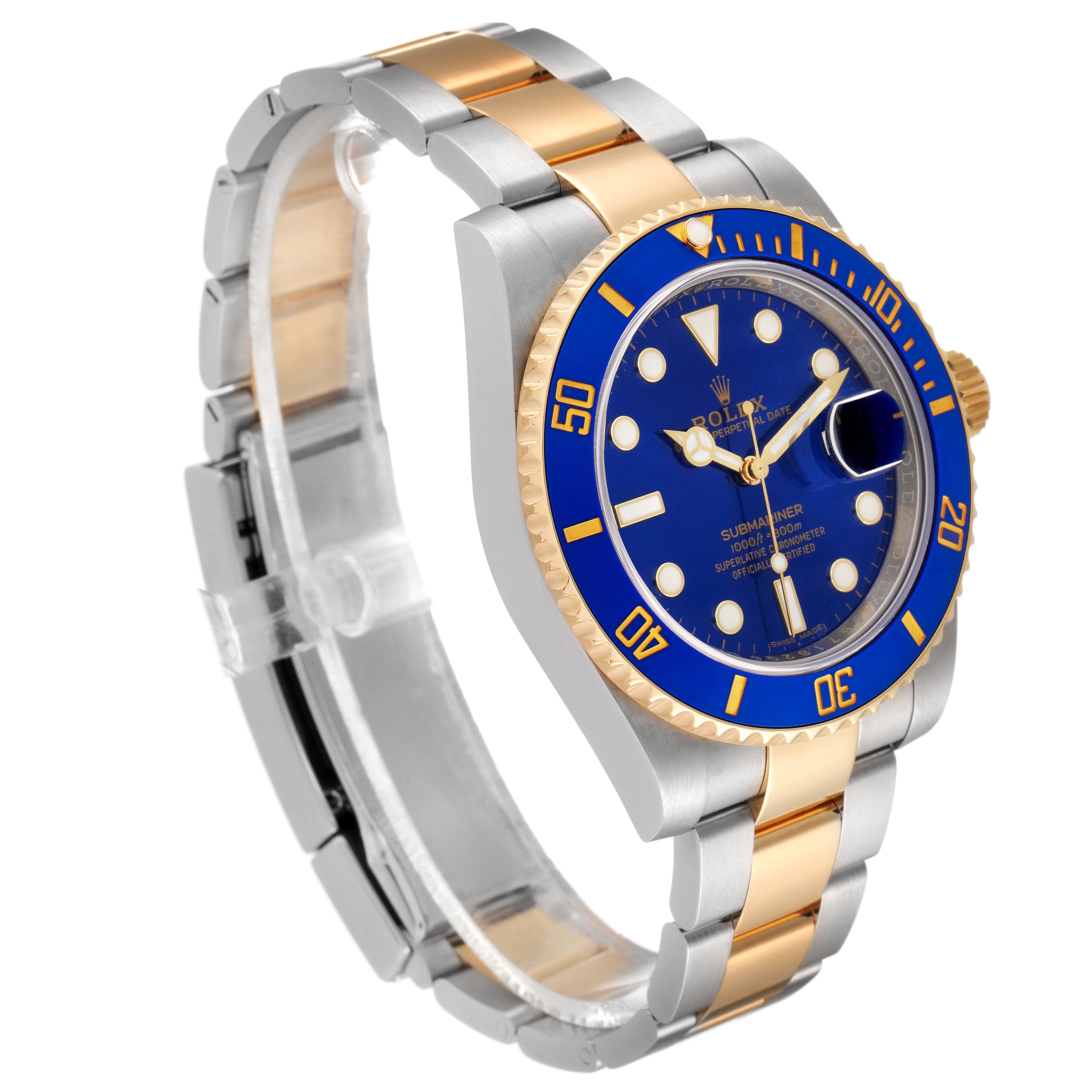 The image shows a Rolex Submariner 116613 Men's Steel and Gold (two tone) Blue Dial 116613 Men's Steel and Gold (two tone) Blue Dial watch at a three-quarter angle, highlighting its blue dial, gold bezel, and two-tone bracelet.
