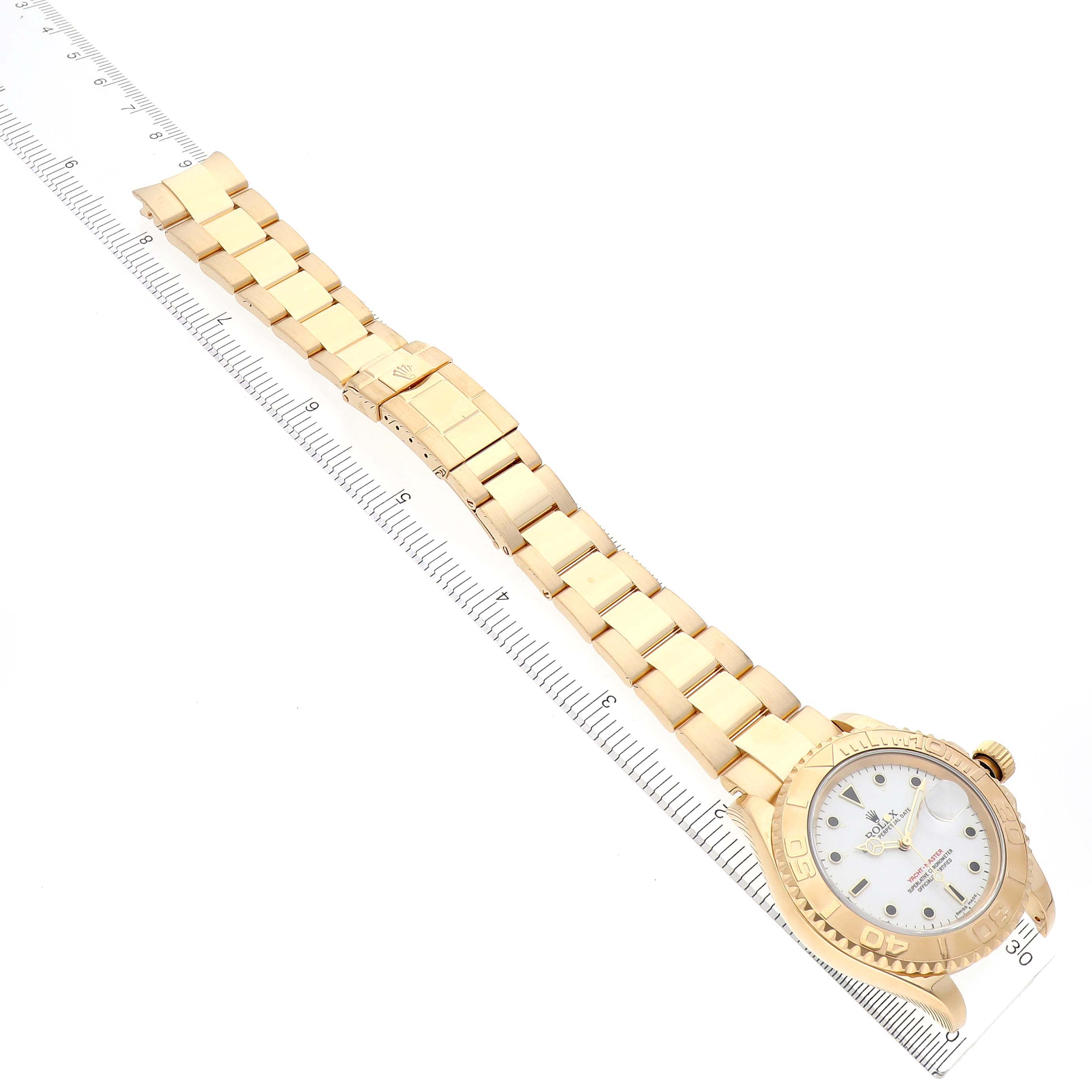 The Rolex Yacht-Master 16628 Men's Yellow Gold White Dial 16628 Men's Yellow Gold White Dial watch is shown from an angled top view, displaying the full bracelet and dial.