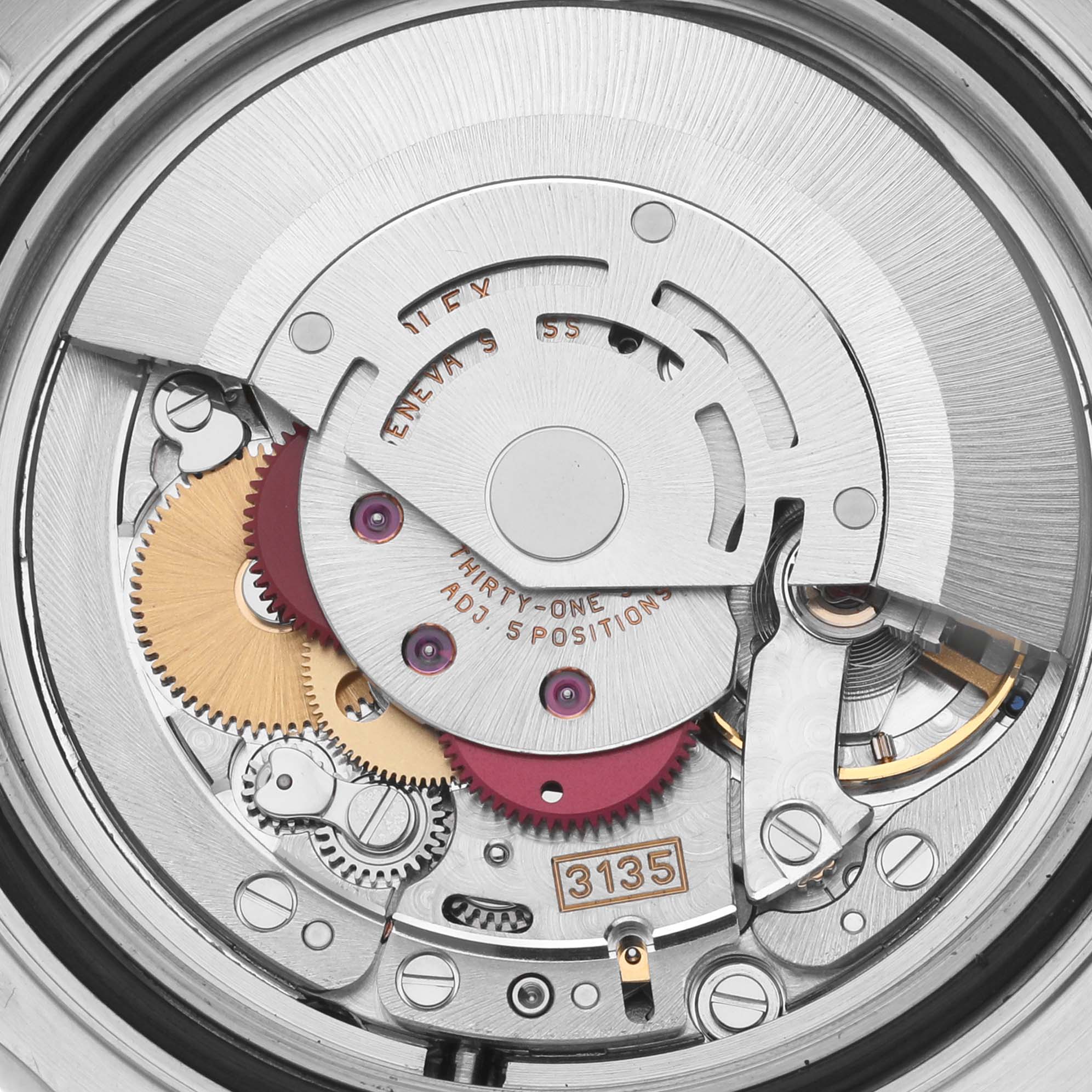 The image shows a close-up of the Rolex Yacht-Master 16622 Men's Steel and Gold (two tone) Silver Dial 16622 Men's Steel and Gold (two tone) Silver Dial's intricate movement components and gears.