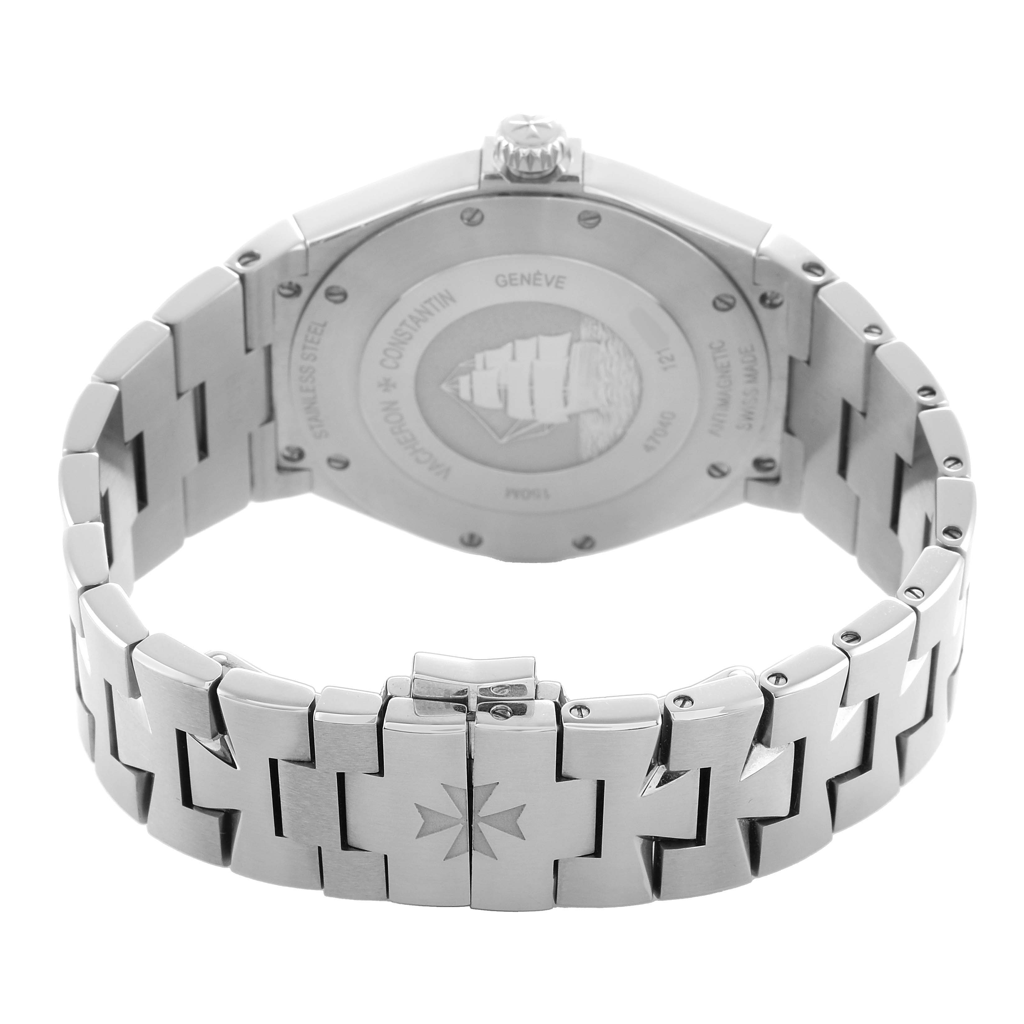 The Vacheron Constantin Overseas 47040 Men's Stainless Steel Silver Dial watch is shown from the back, highlighting the case back and bracelet with a visible clasp.