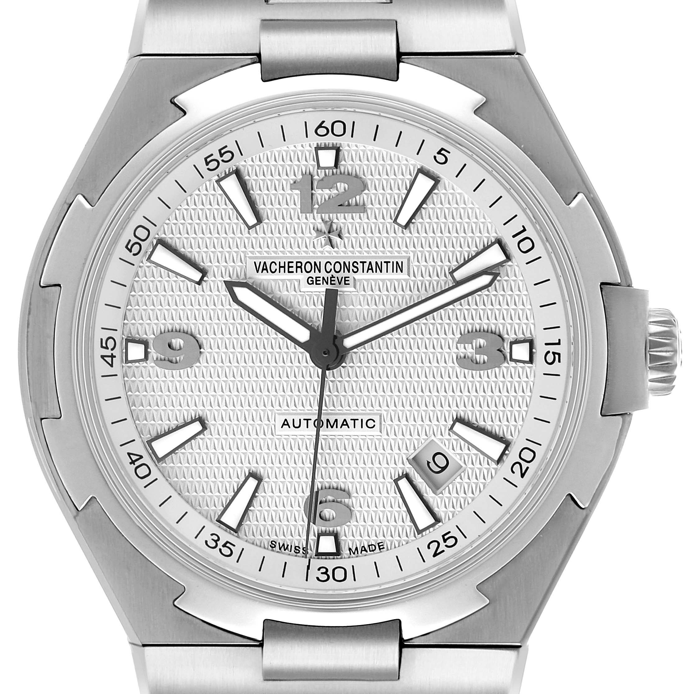 The Vacheron Constantin Overseas 47040 Men's Stainless Steel Silver Dial watch is shown from a top-down angle, highlighting the dial, bezel, and part of the bracelet.
