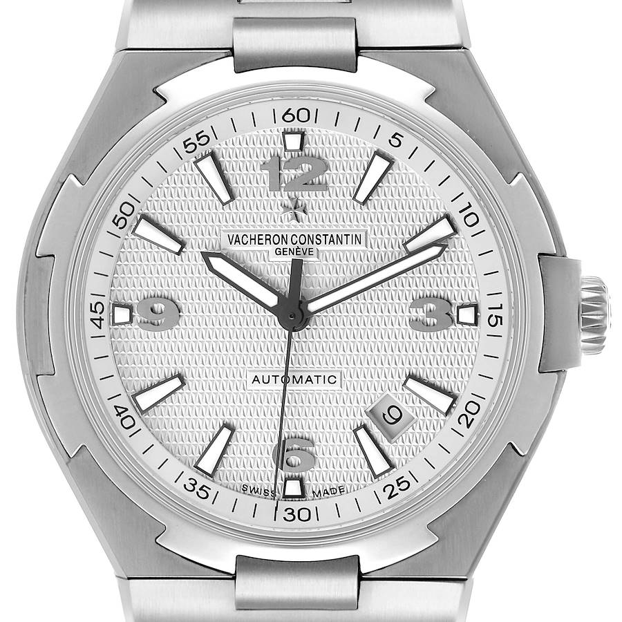 The Vacheron Constantin Overseas 47040 Men's Stainless Steel Silver Dial watch is shown from a top-down angle, highlighting the dial, bezel, and part of the bracelet.