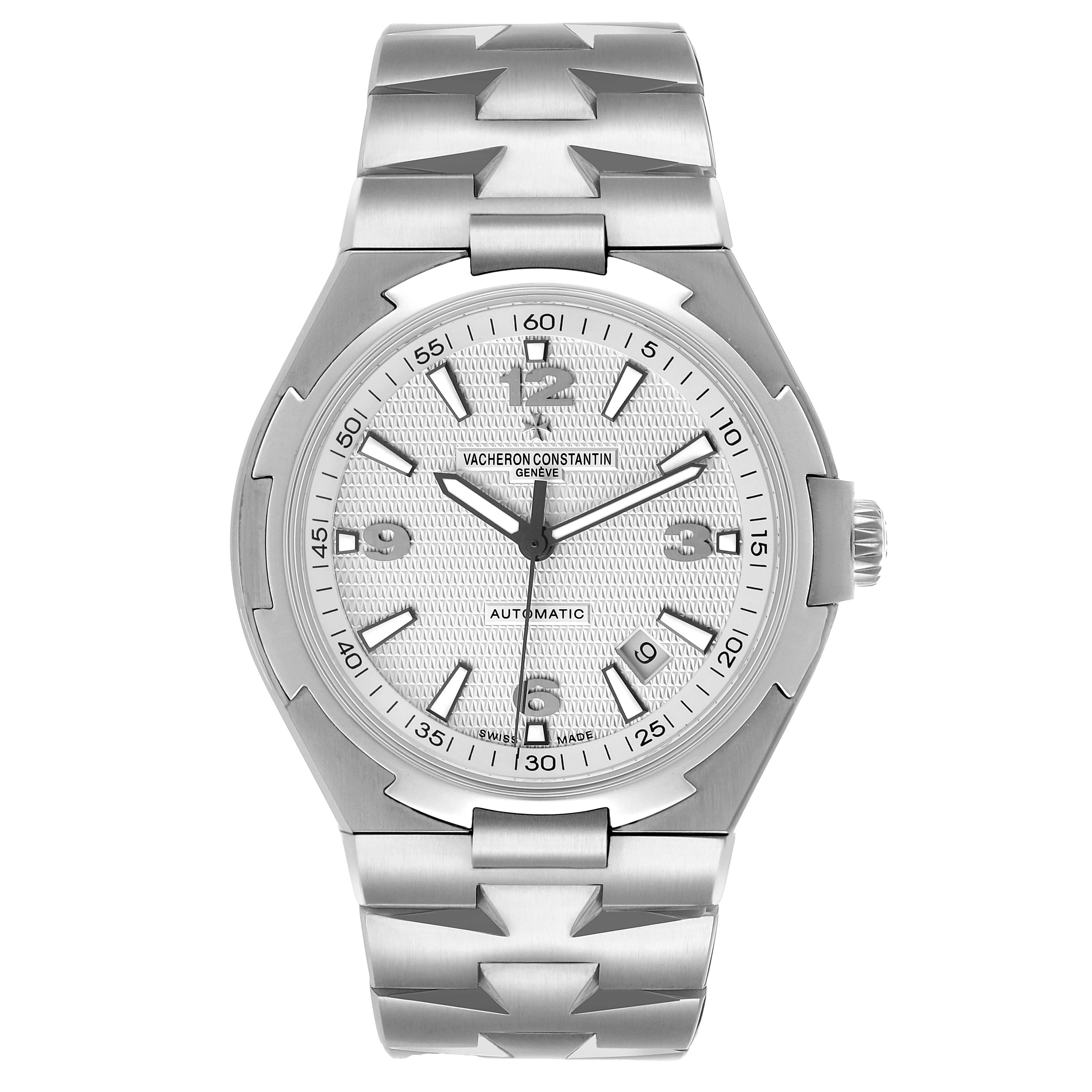 The Vacheron Constantin Overseas 47040 Men's Stainless Steel Silver Dial watch is shown from a top-down angle, highlighting its dial, bezel, and bracelet.