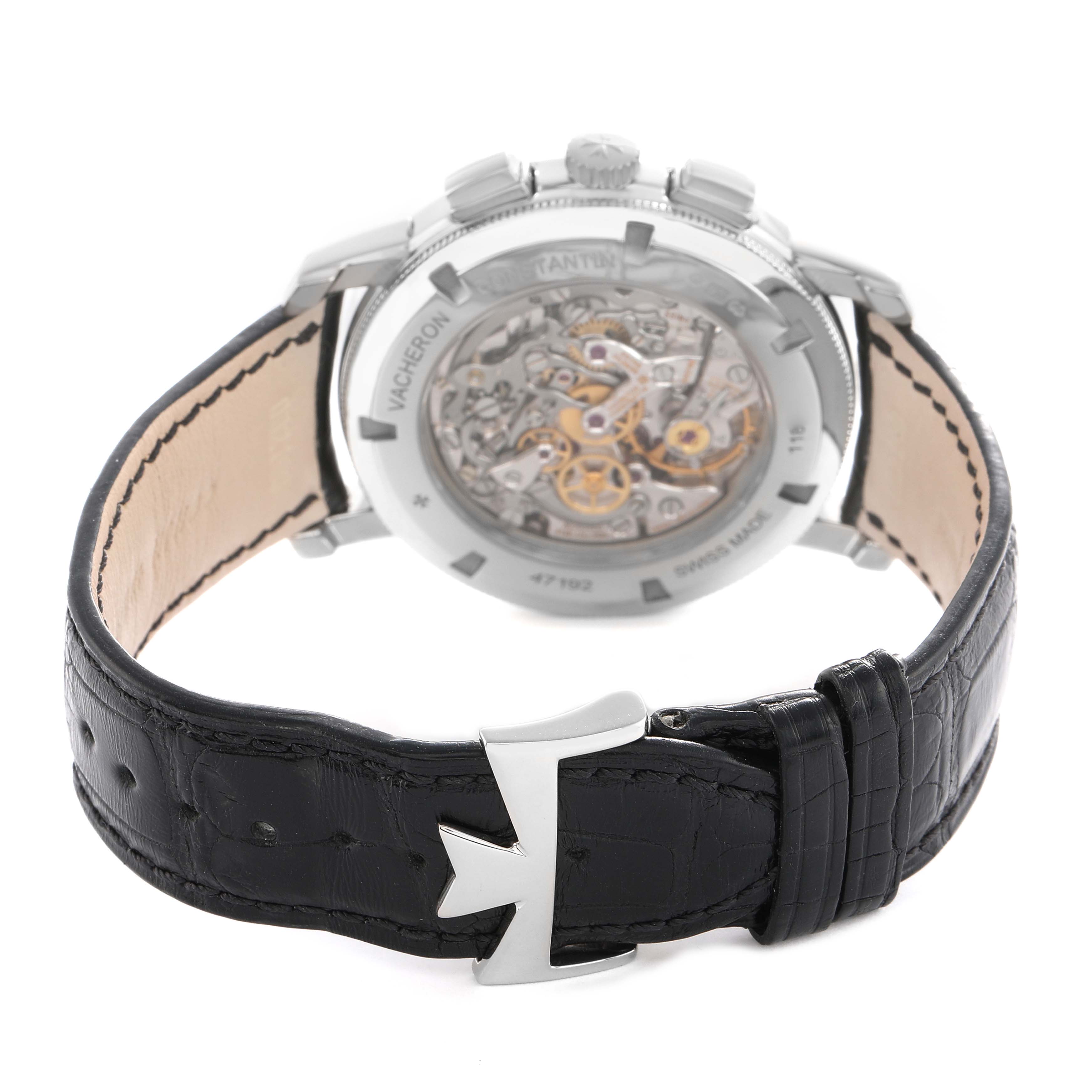 The Vacheron Constantin Traditionnelle 47192 Men's White Gold Silver Dial watch is shown from the back, displaying its transparent case back and leather strap with a buckle.