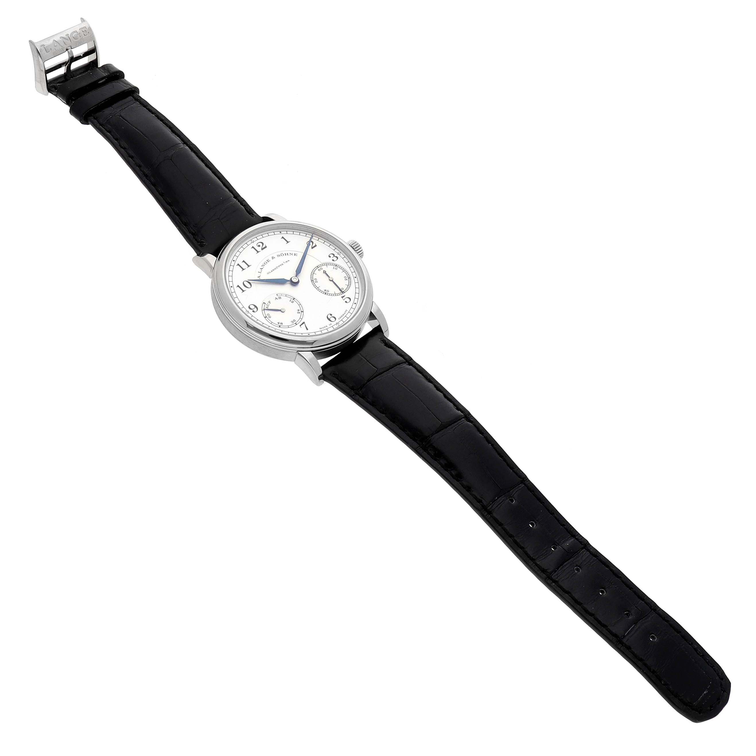 The A. Lange 
Sohne 1815 234.026 Men
s White Gold Silver Dial watch is shown from a top angle, displaying its face, strap, and clasp.