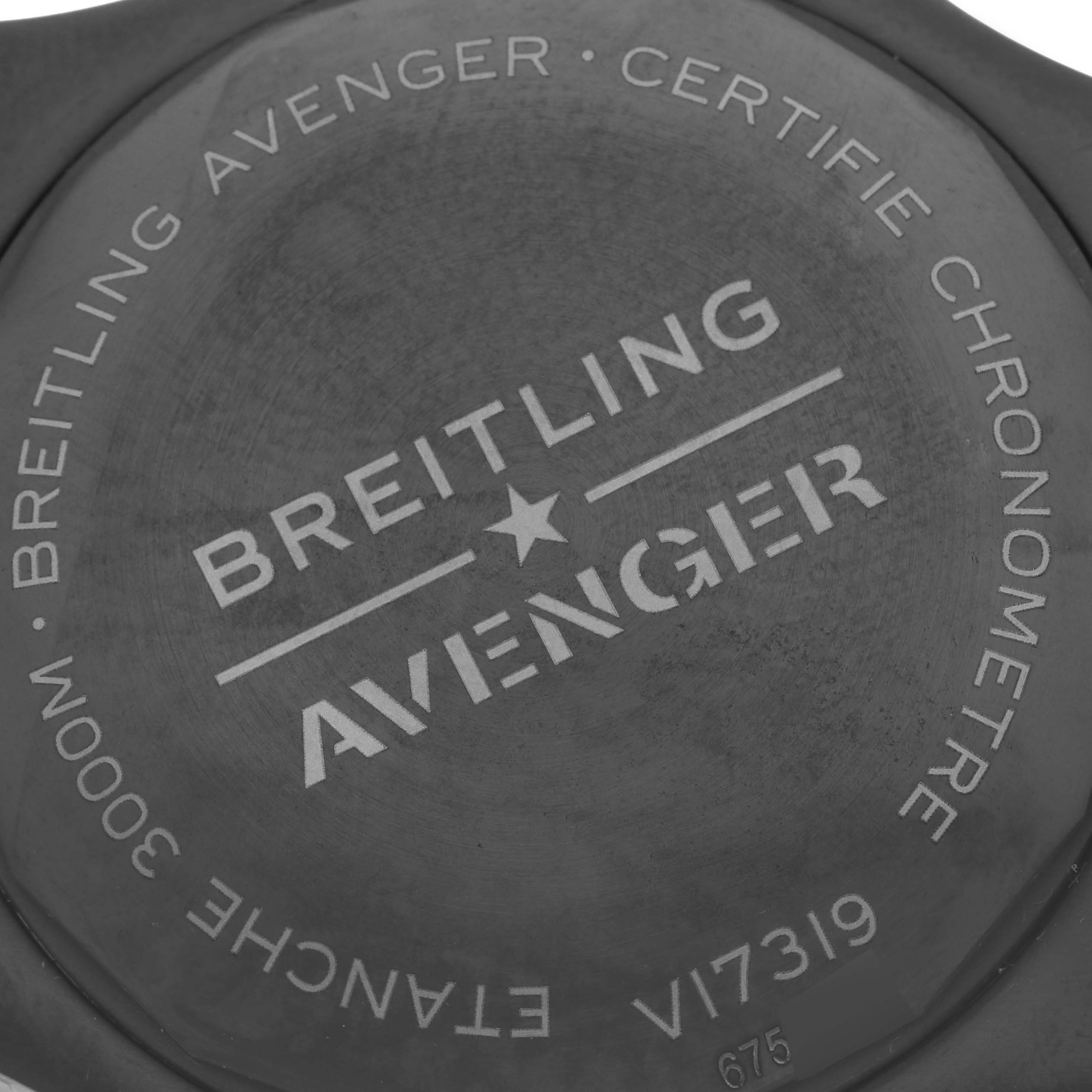 The image shows the back case of the Breitling Avenger V17319 Men's Titanium Black Dial V17319 Men's Titanium Black Dial watch, displaying branding and model details.