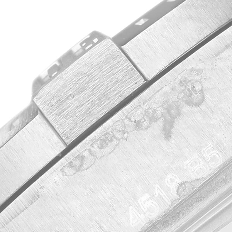 This image shows a close-up of the serial number and part of the clasp on a Breitling Colt A17313 Men
s Stainless Steel White Dial A17313 Men
s Stainless Steel White Dial watch.