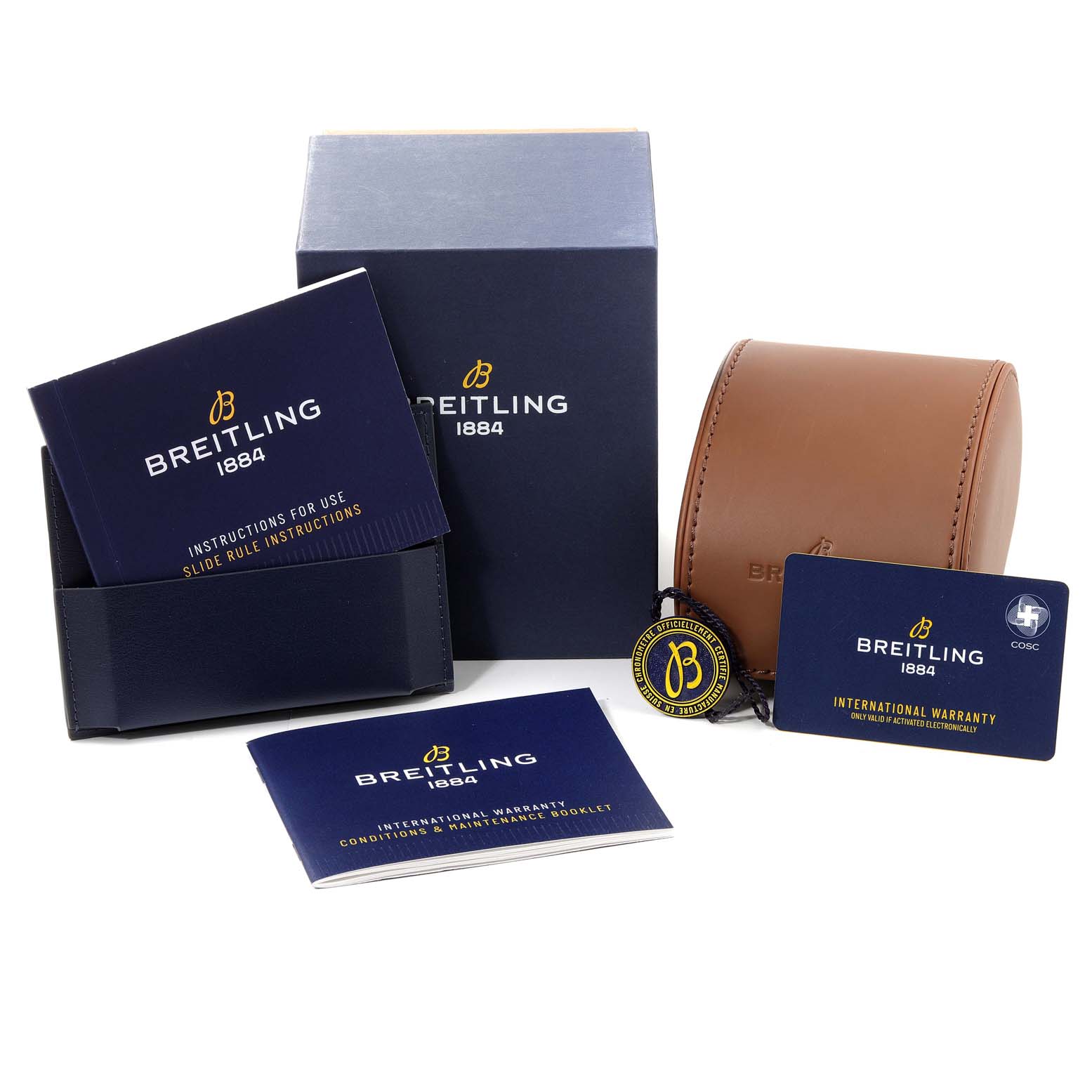 The image shows the packaging and accessories of a Breitling Navitimer U13324211B1X1 Men's Steel and Gold (two tone) Black Dial U13324211B1X1 Men's Steel and Gold (two tone) Black Dial watch, including manuals, a warranty card, a box, and a travel case.