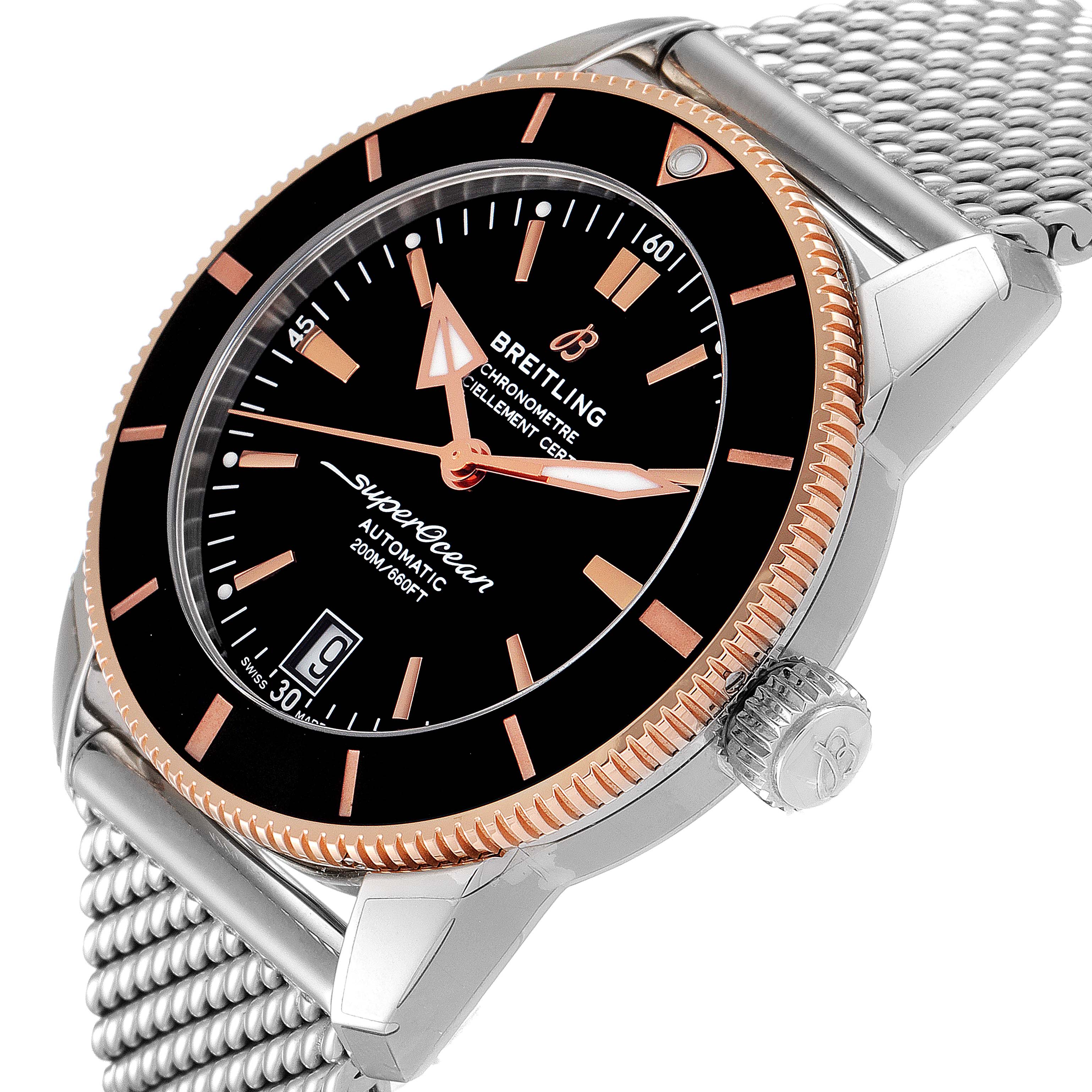 The image shows a close-up view of the Breitling Superocean UB201012/BG53/154A Men
s Steel and Gold (two tone) Black Dial UB201012/BG53/154A Men
s Steel and Gold (two tone) Black Dial watch, focusing on the dial, bezel, crown, and part of the band at an angle.