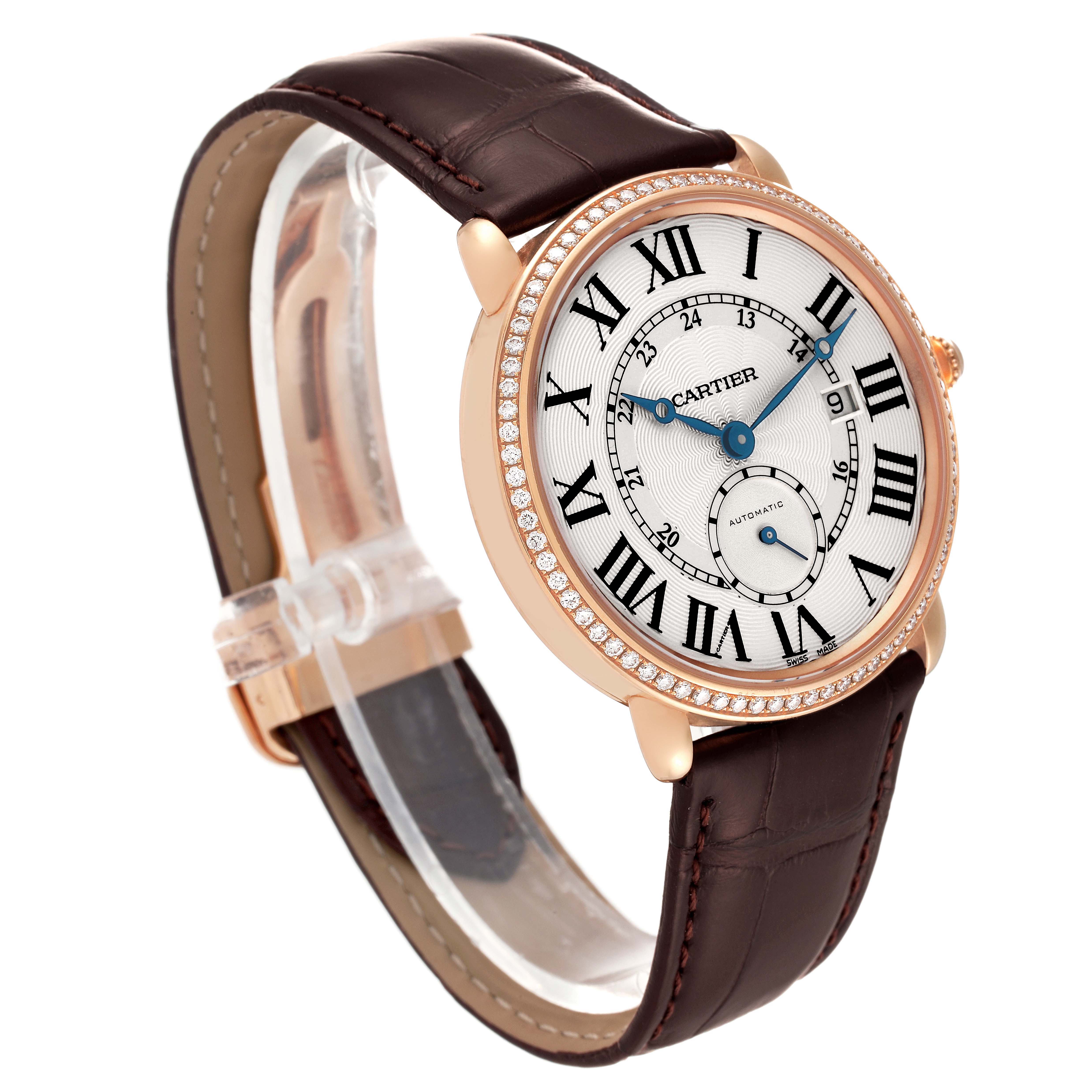 The Cartier Ronde WR007017 Men's Rose Gold Silver Dial watch is shown at a three-quarter angle, highlighting its dial, bezel, and leather strap.